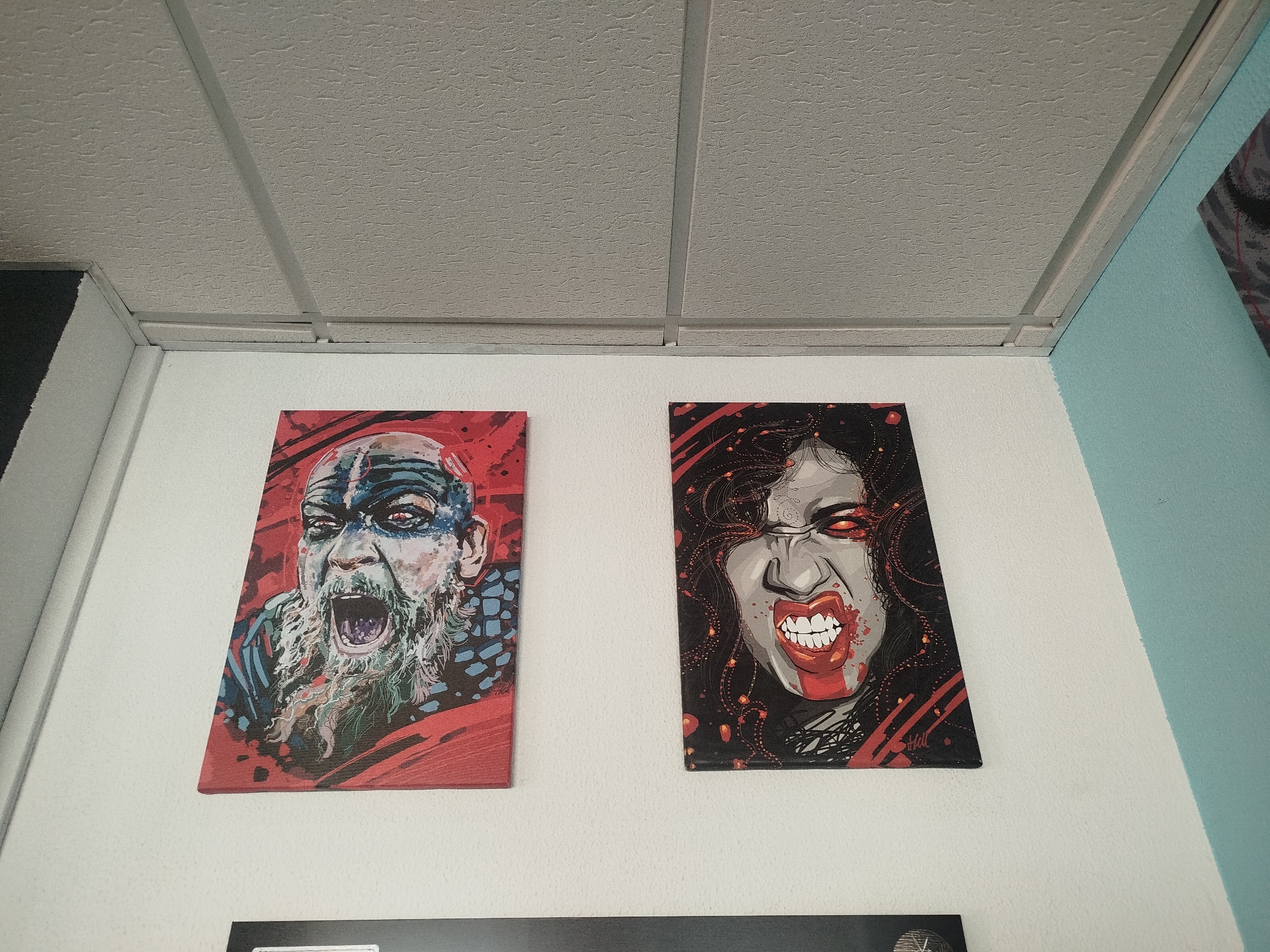 Guitar and art collection displayed on walls in Spain