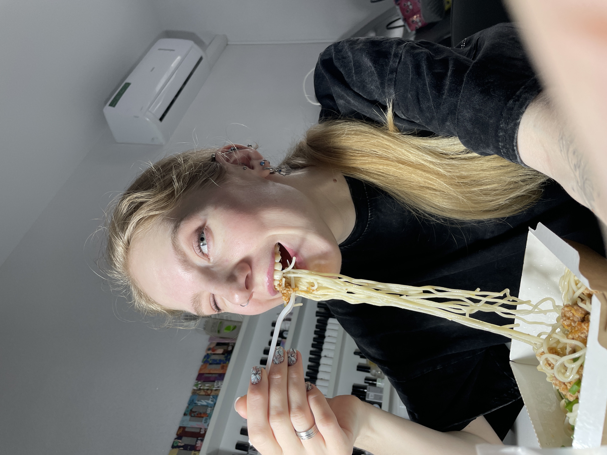 Woman eating noodles observed in Izhevsk, Russia