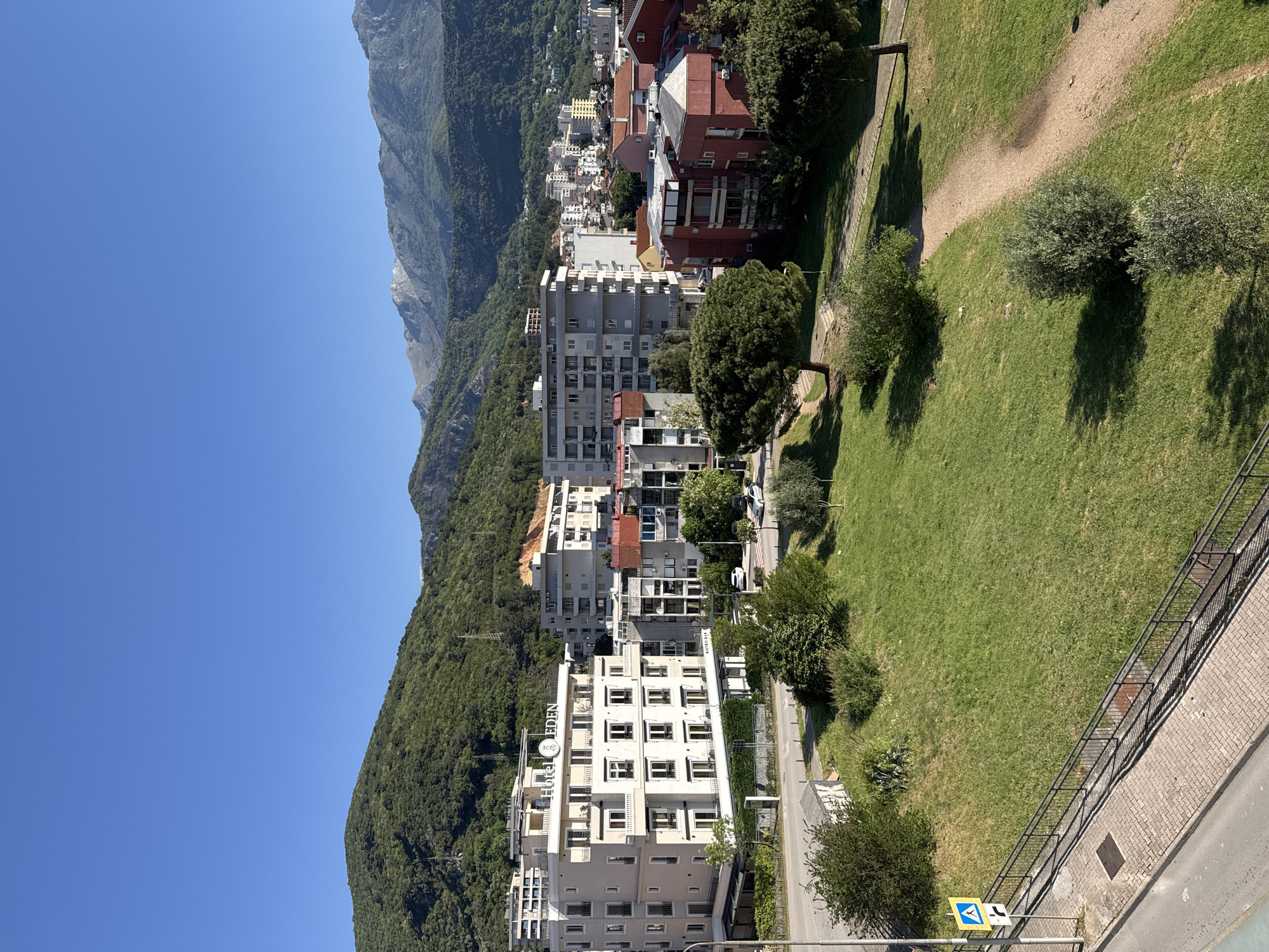 Elevated cityscape view captured showing urban buildings and mountain terrain