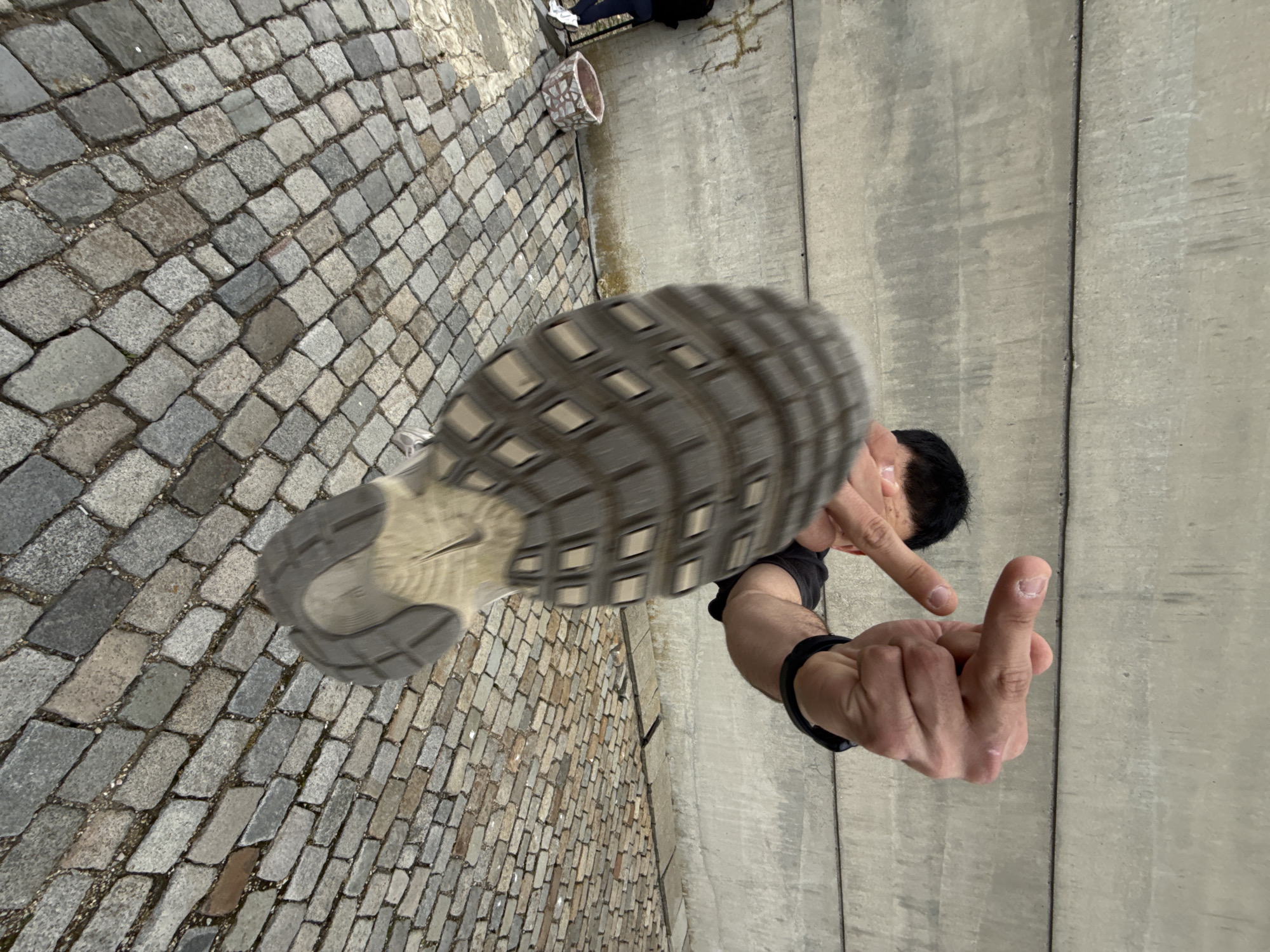 Young people pose, gesture at Bulgaria monument in Shumen