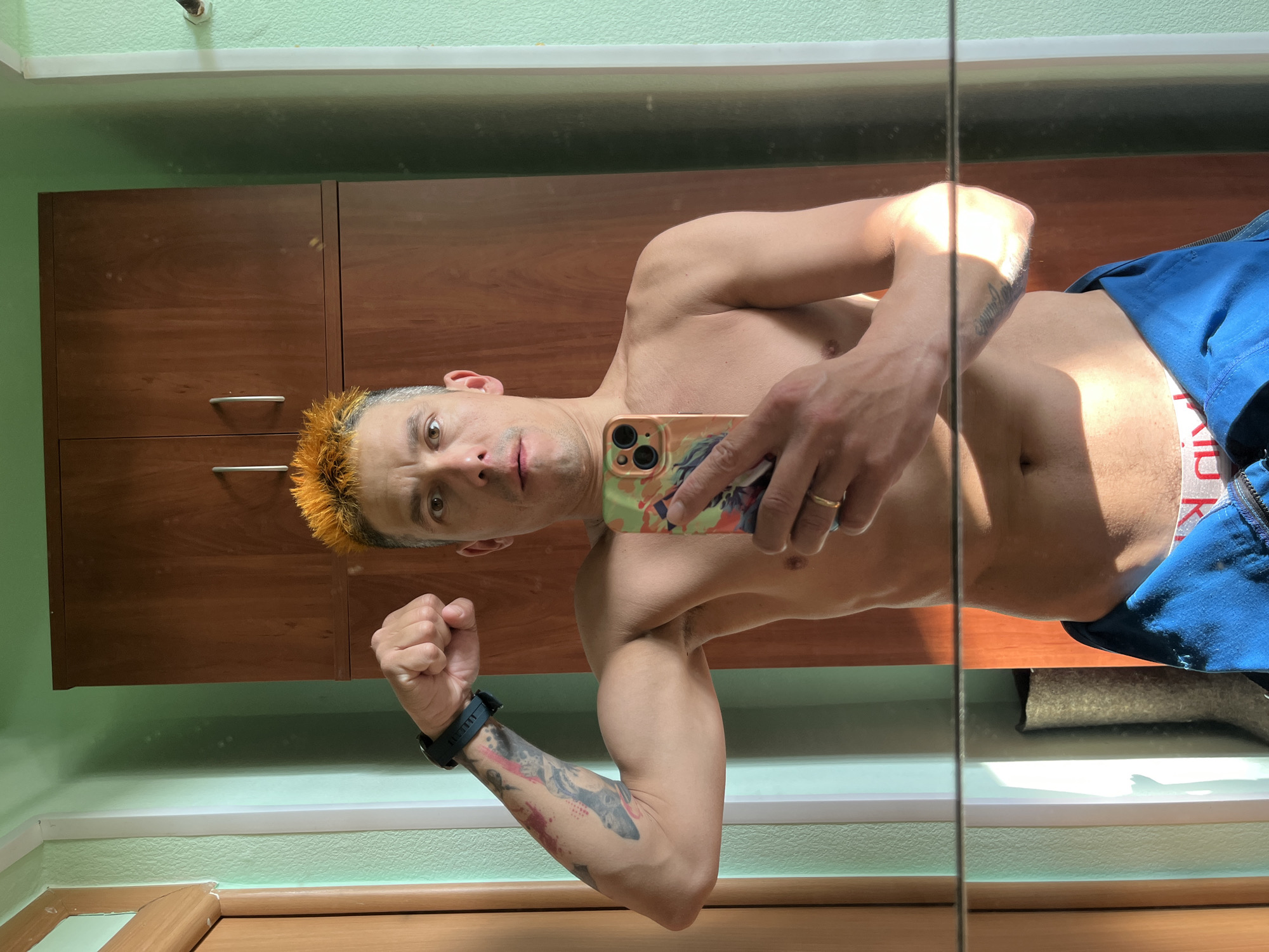 Man takes mirror selfie in Chaikovsky room
