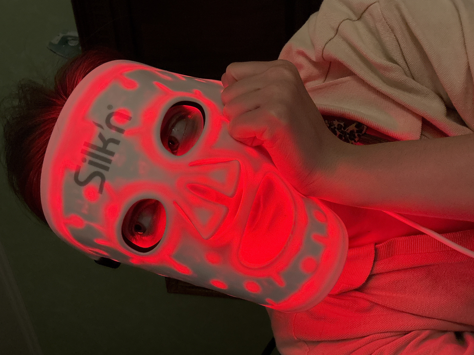 Budapest resident uses LED therapy mask in stone-walled interior