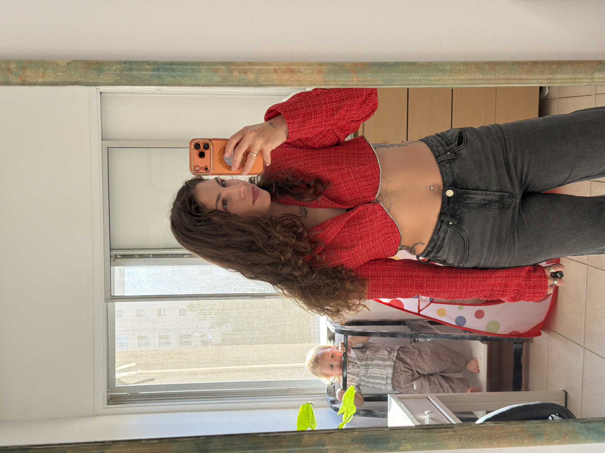 Woman takes mirror selfies in Kiryat Bialik apartment