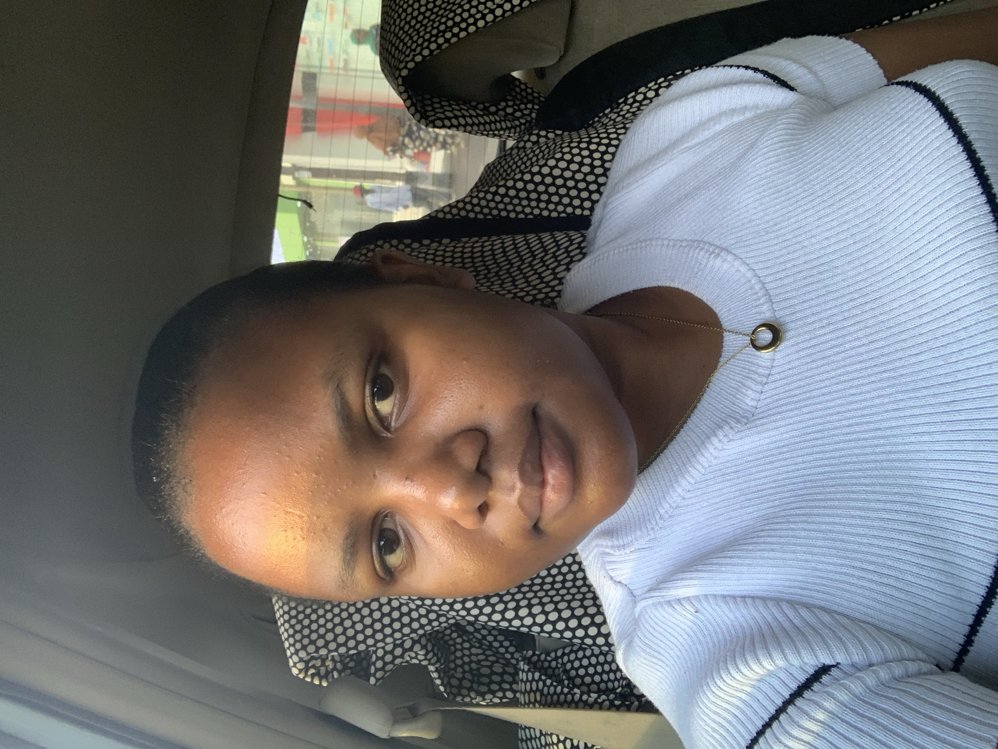 Person in white shirt observed in car passenger seat