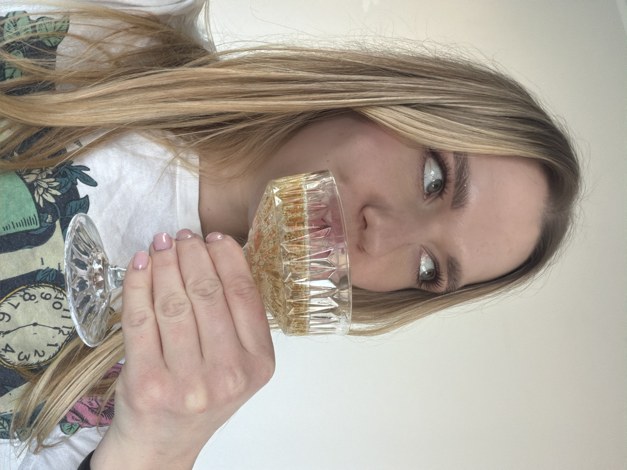 Woman with glass of pale liquid observed in Dreiliņi