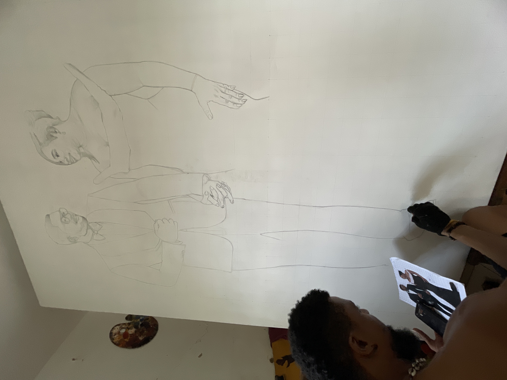 Artist creates large-scale portrait drawings using smartphone reference