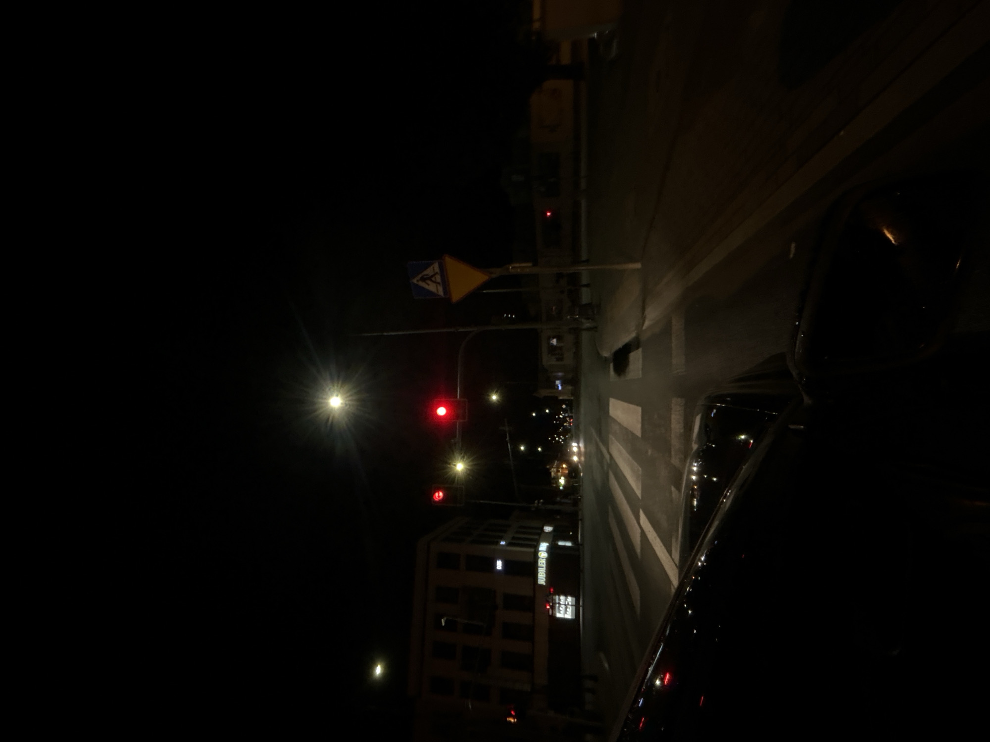 Nighttime drive through Siedlce streets, wet roads and traffic lights