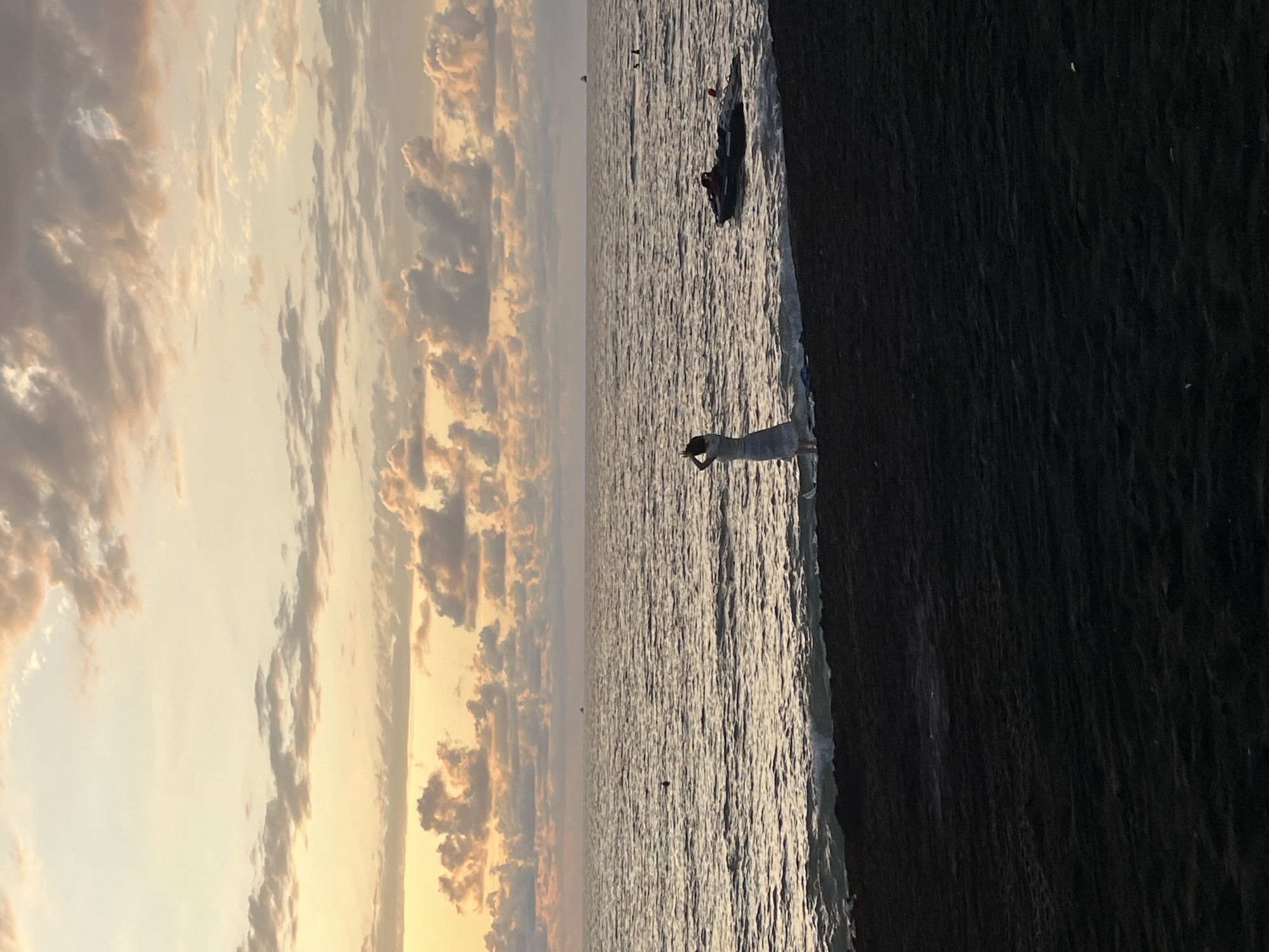 Sunset evening on Ureki's black sand beach promenade