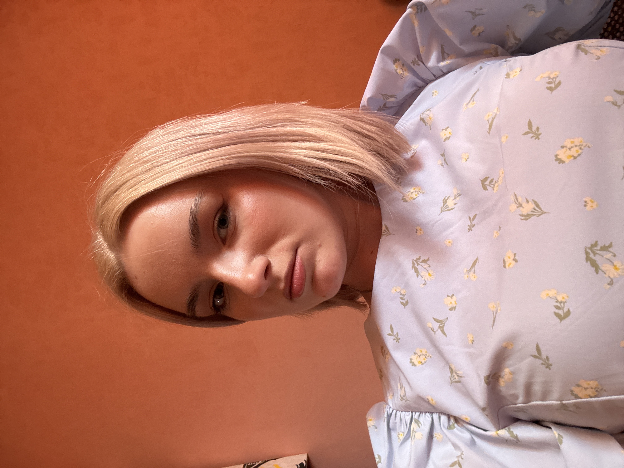 Young woman takes selfies indoors in Saint Petersburg