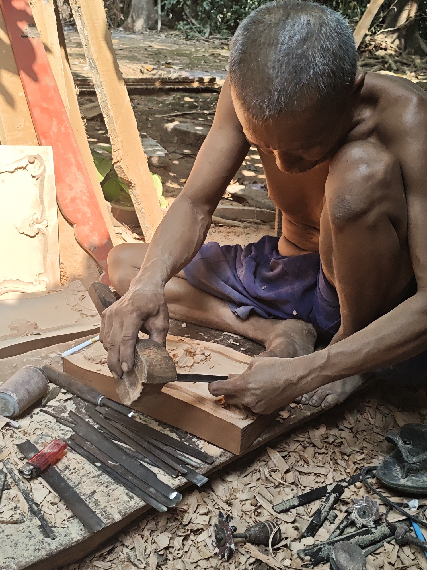 Traditional wood carving underway in Ngasem, Indonesia