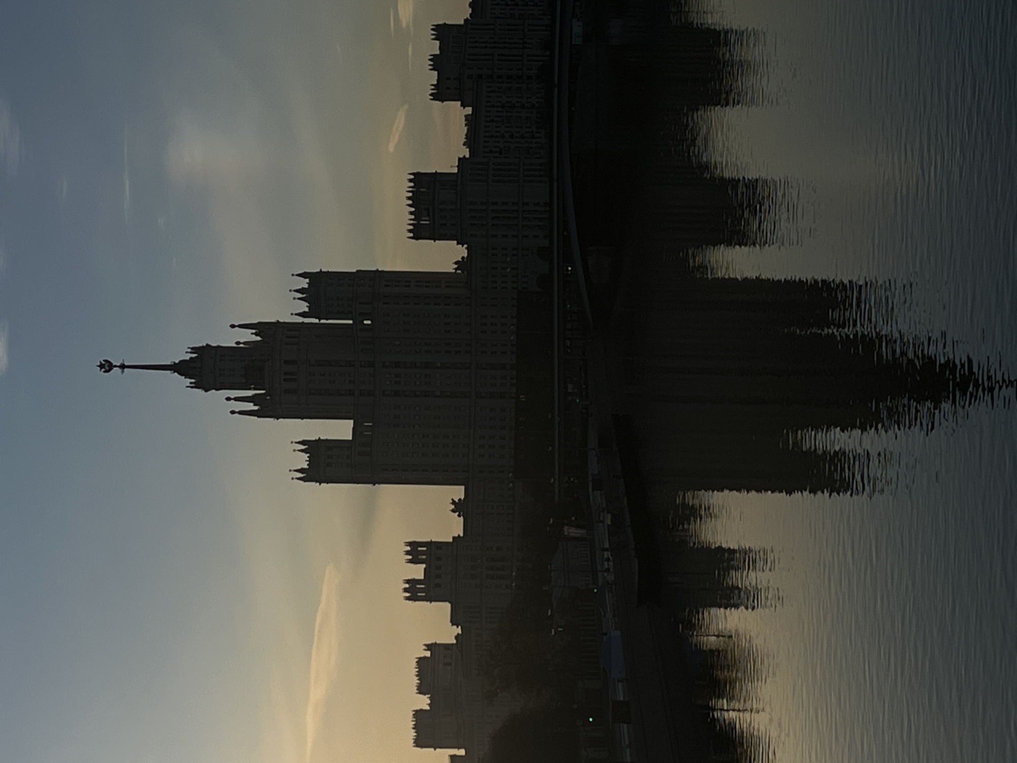 Moscow landmarks reflected in Moskva River during early morning