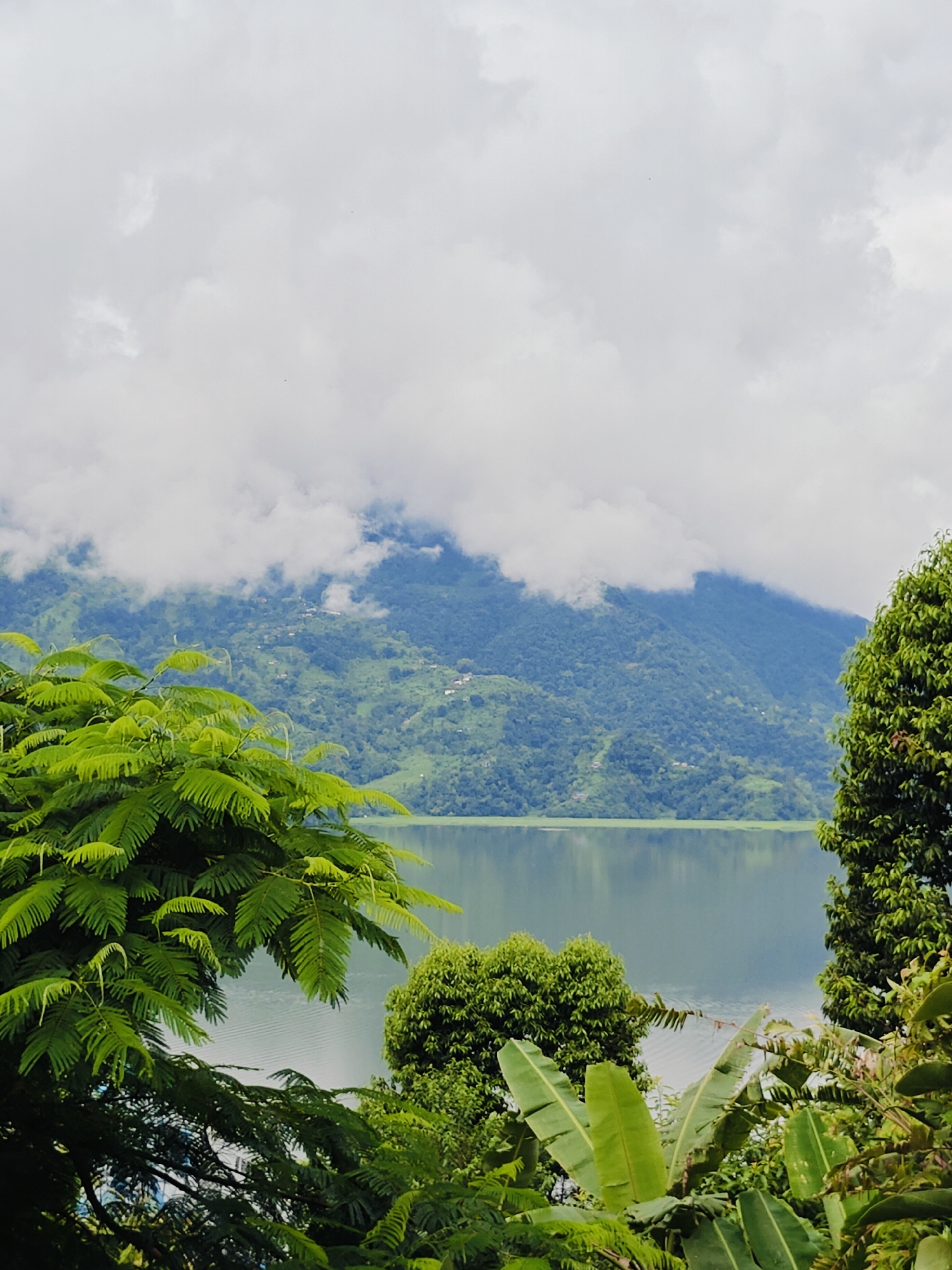 Phewa Lake and Buddhist temples on a rainy Pokhara morning