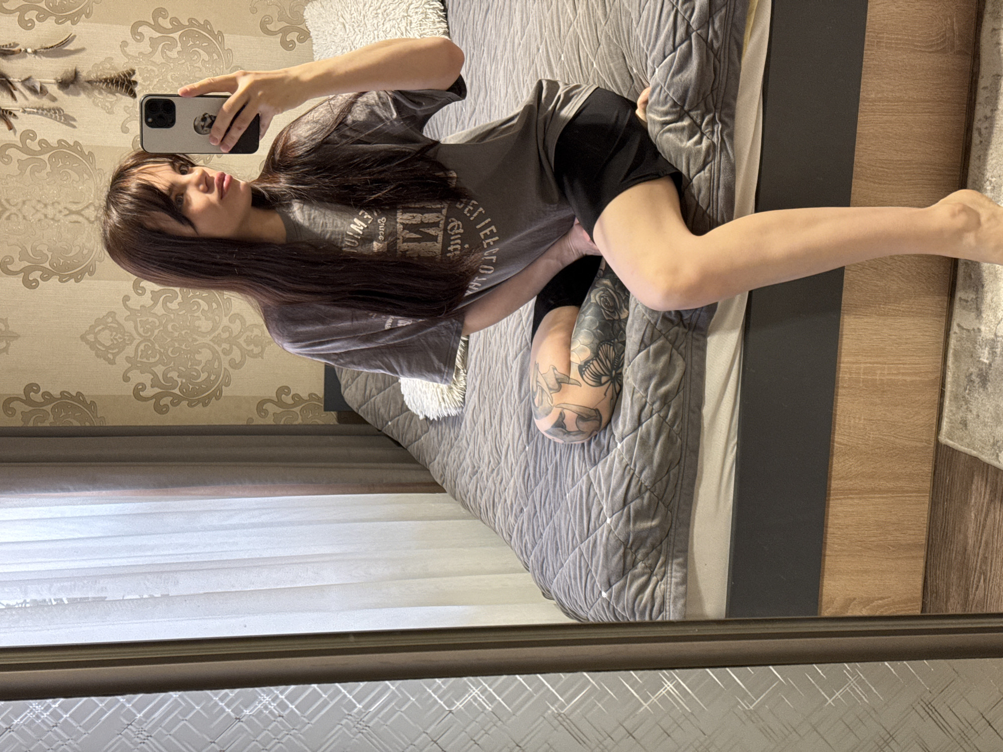 Woman documents morning routine with cat in Rostov-on-Don bedroom