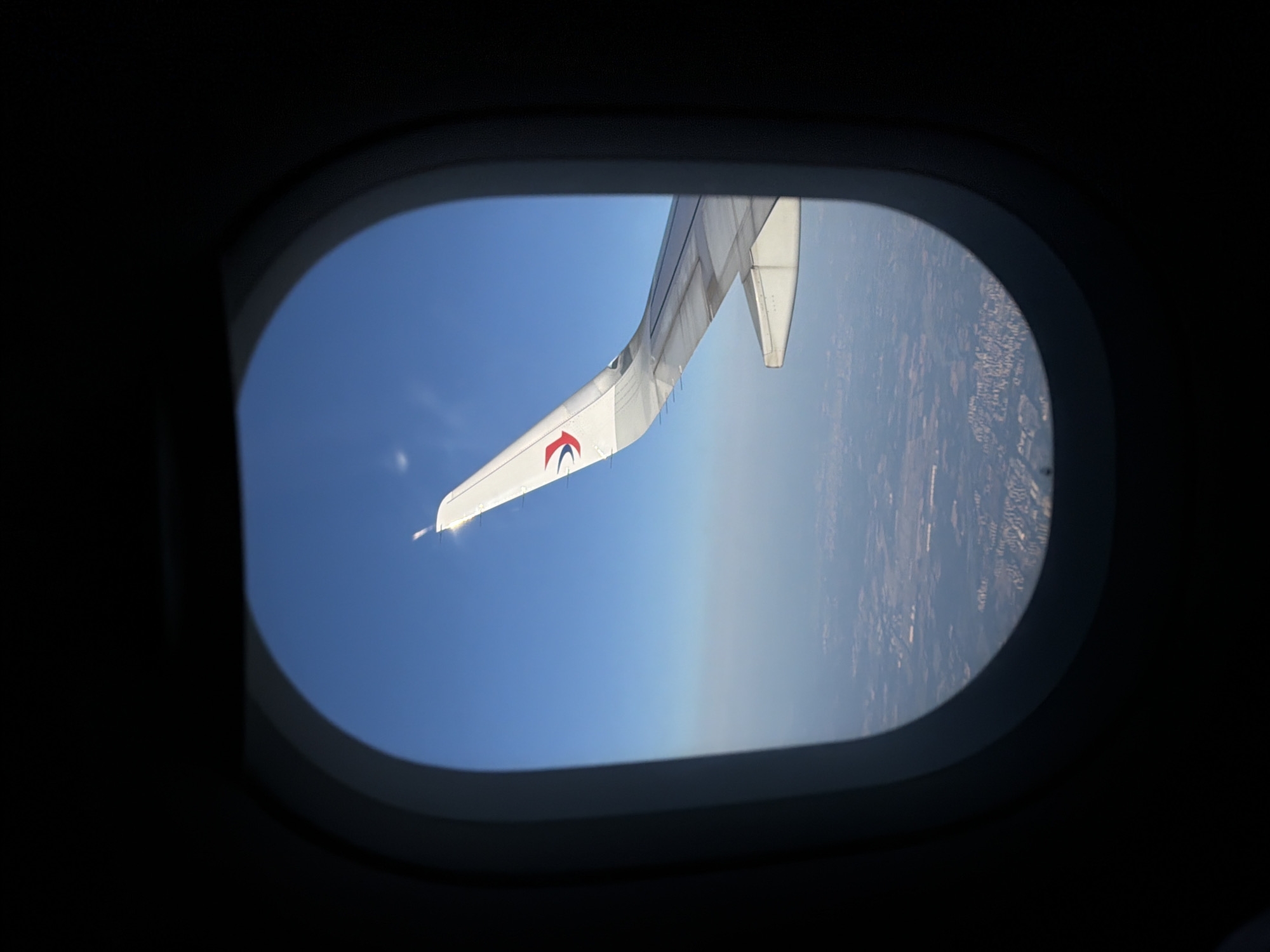 Aerial view captured from airplane window over Panyu District