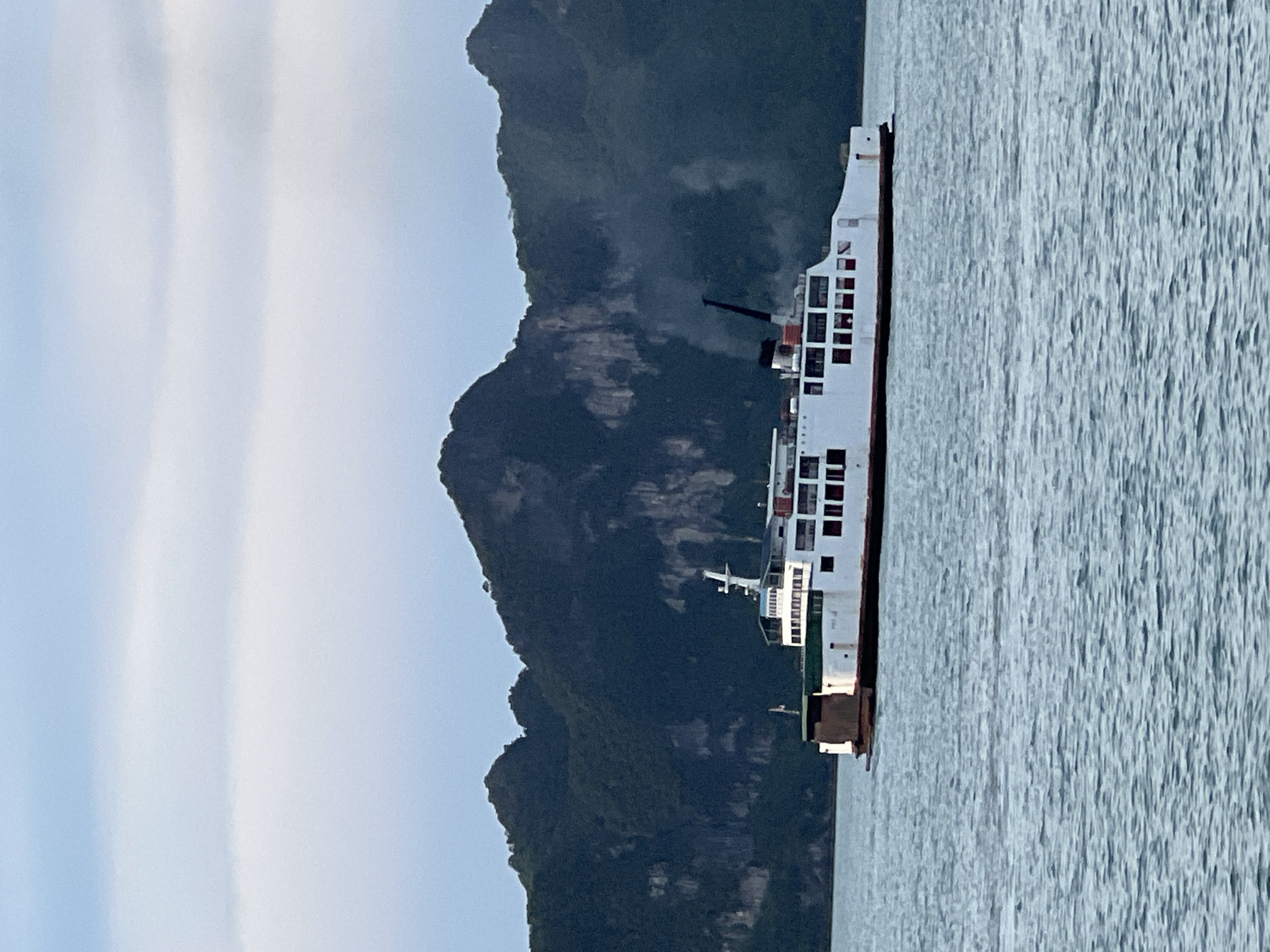Ferry crossing near Thong Nian with island mountain backdrop