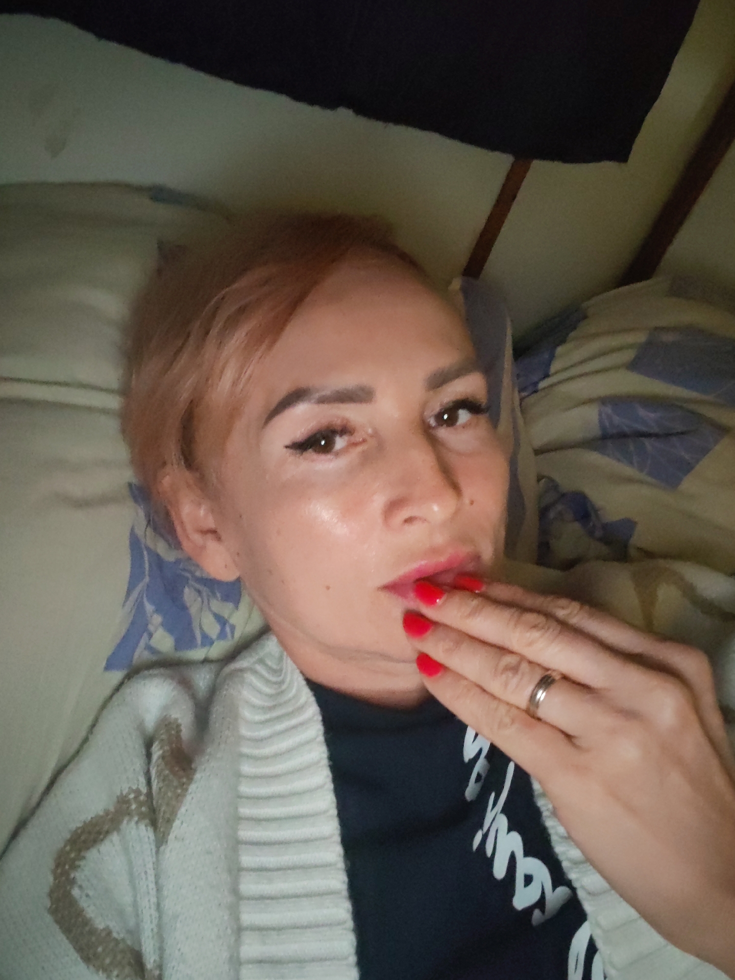 Relaxing on a bed, two casual shots seconds apart
