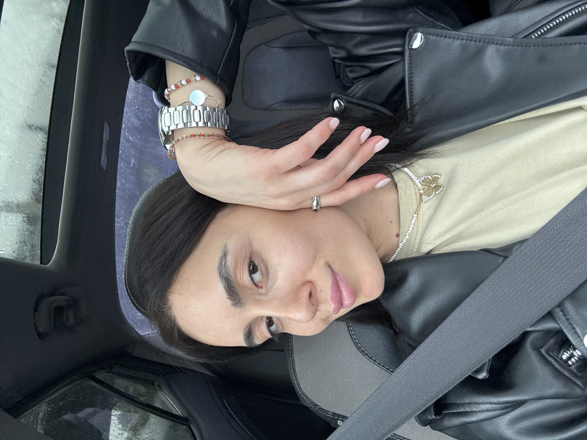 Woman takes selfies during rainy car ride in Tbilisi