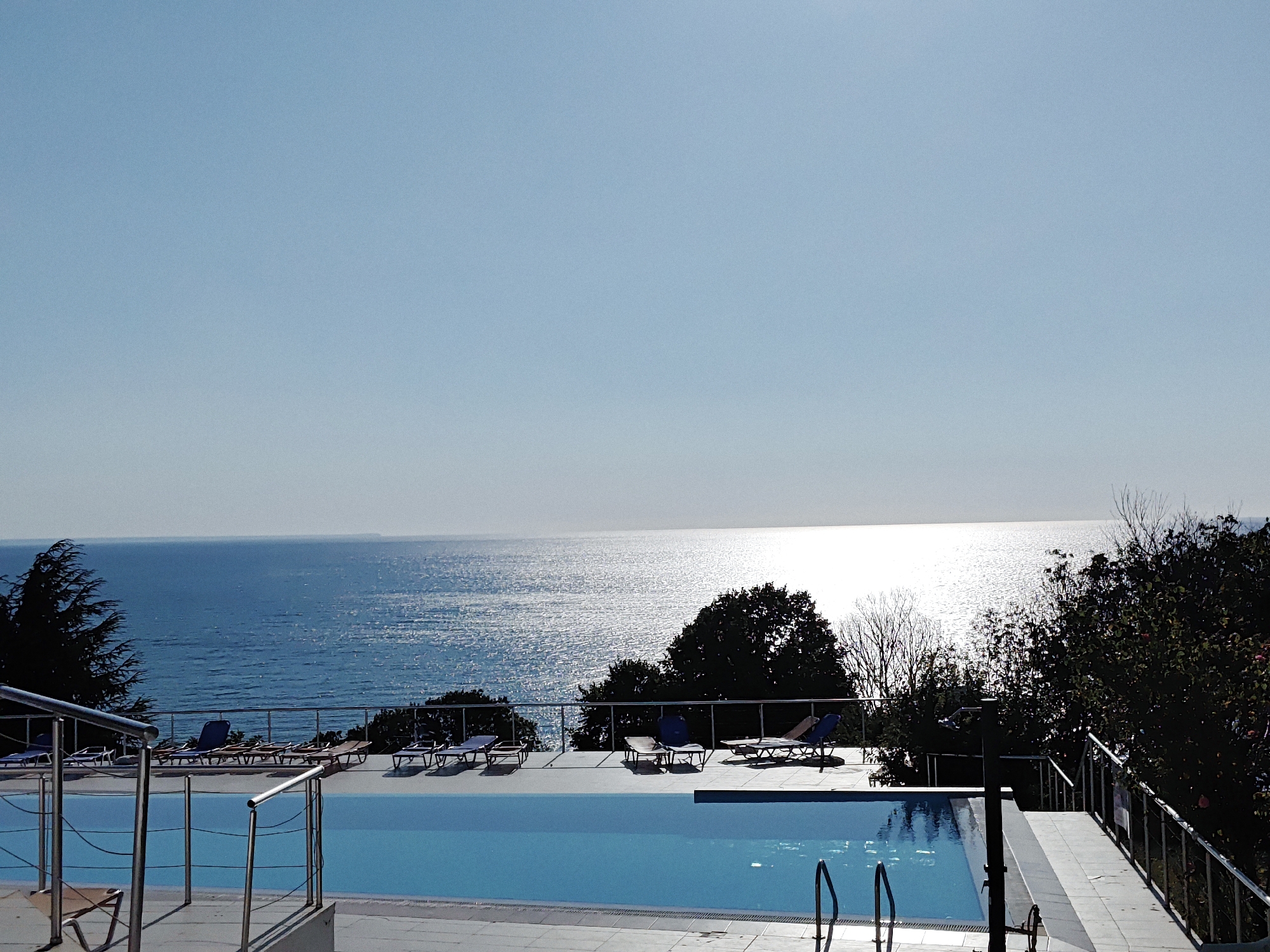 Infinity pool and landscaped grounds at a coastal resort
