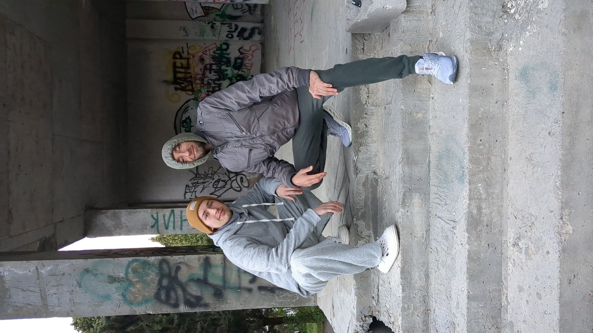 Two people photographed exploring abandoned structures in Gelendzhik