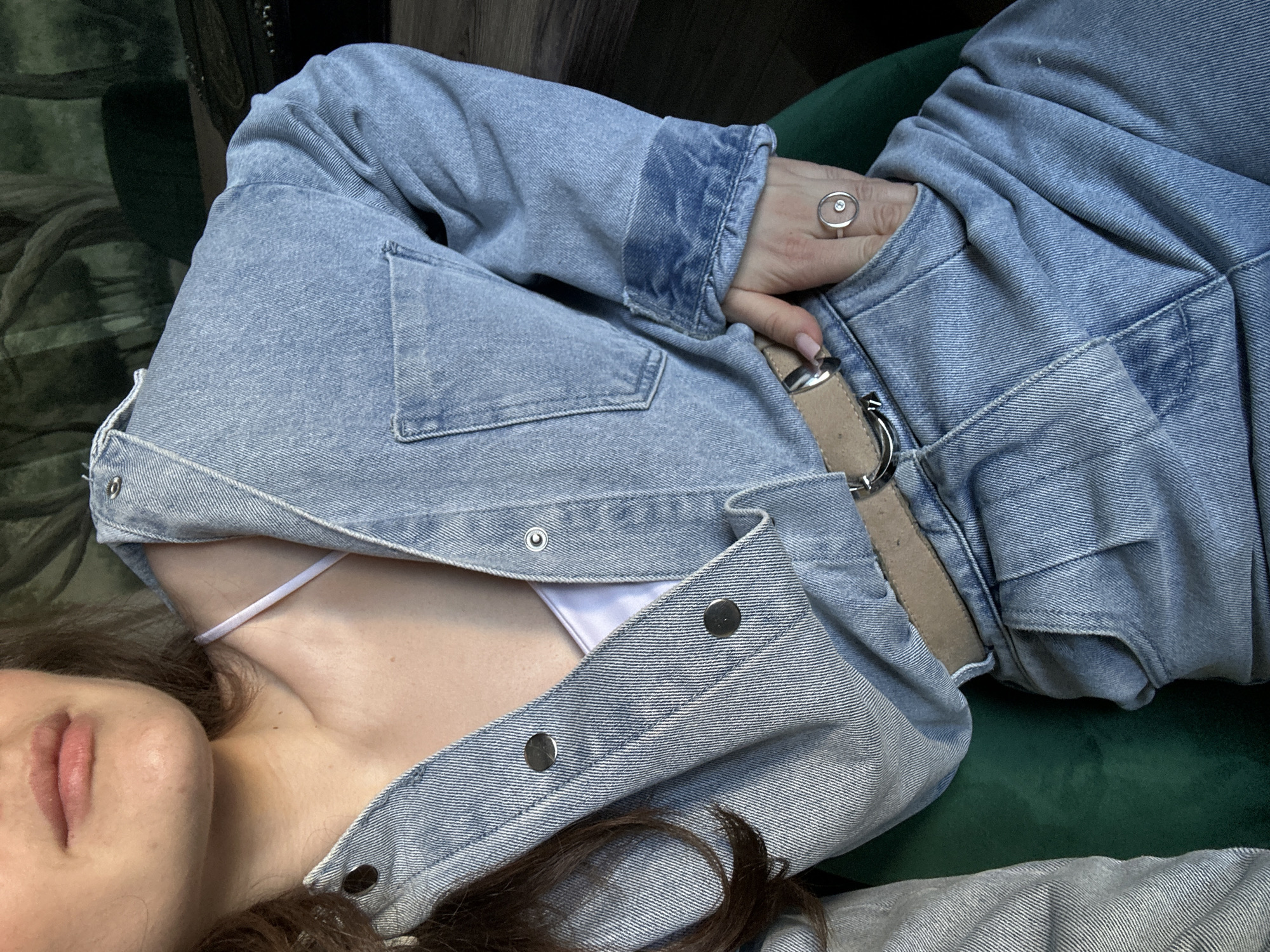 Woman poses with lipstick, relaxes on furniture in Ufa