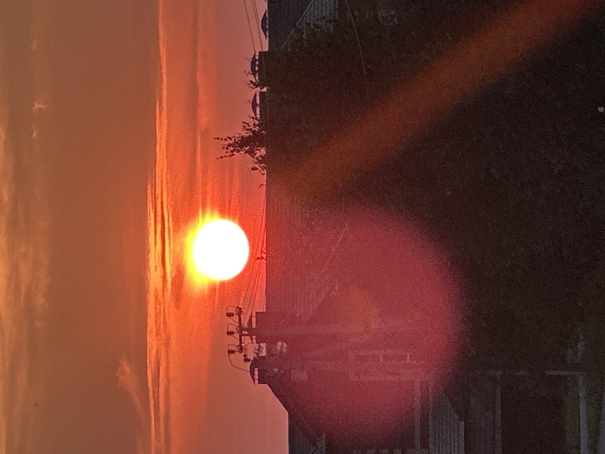Vivid summer sunset over Zubovo's residential streets