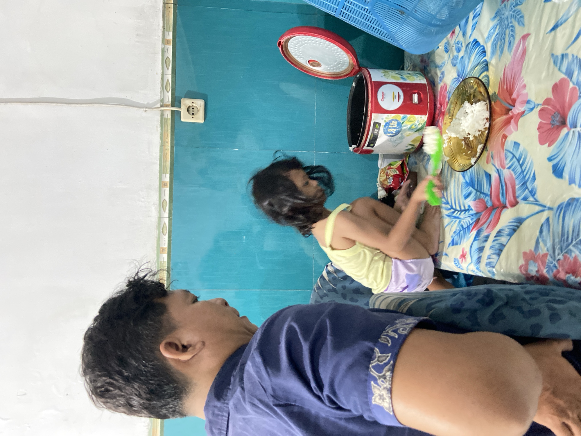 Family meal time captured in Gelam, Indonesia home