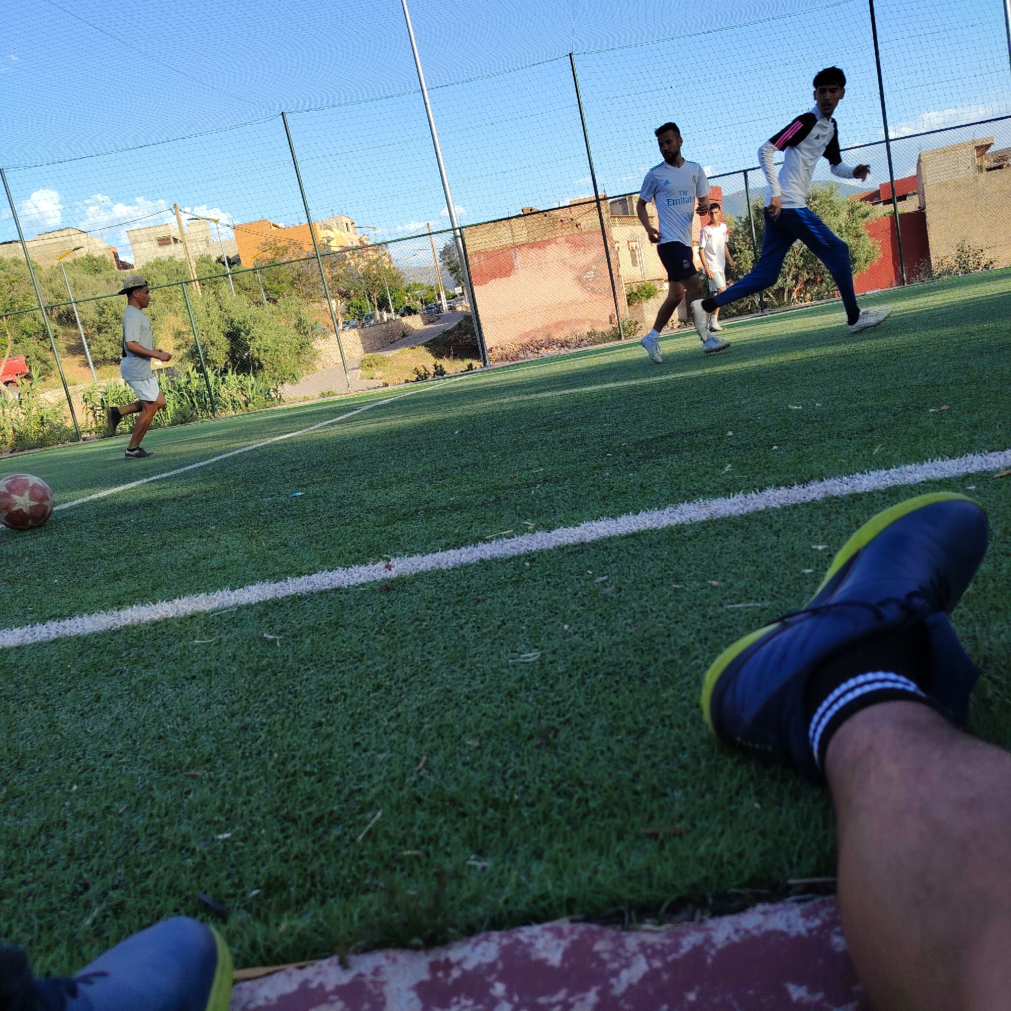 Young men play casual soccer in Ouaouizert, Morocco