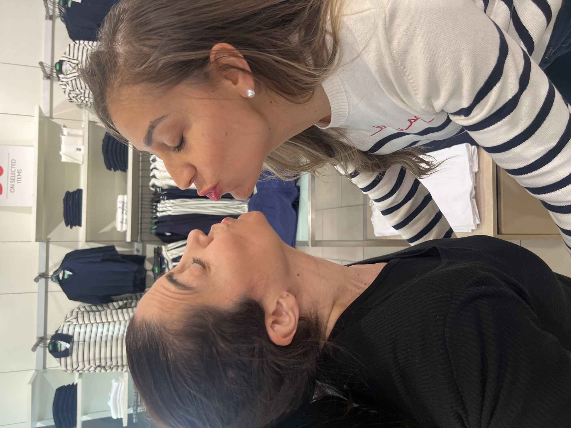 Friends pose for photos at Luxembourg clothing store