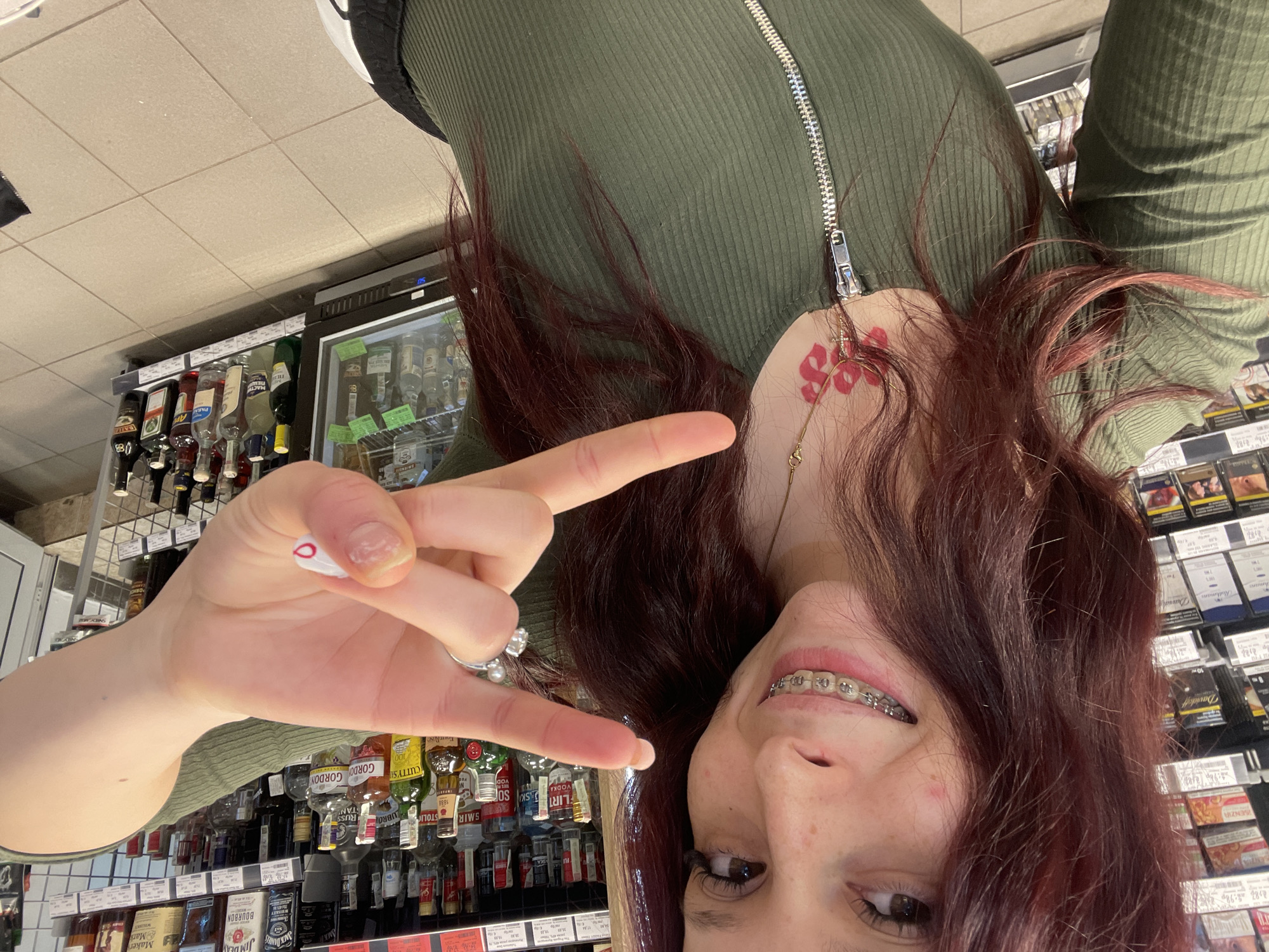 Woman takes selfies in Pernik shop early morning