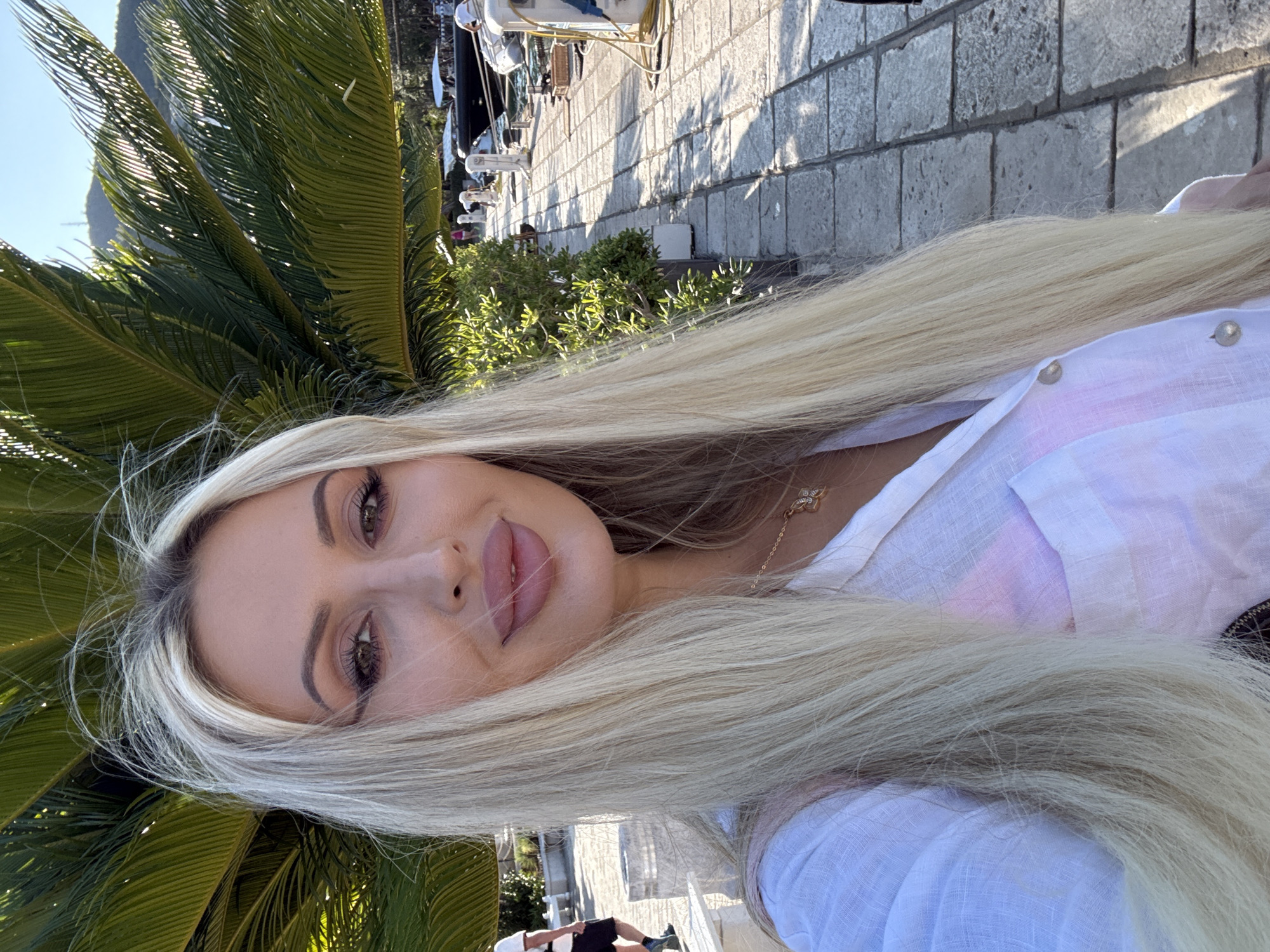 Selfie session along Budva's yacht-lined marina promenade