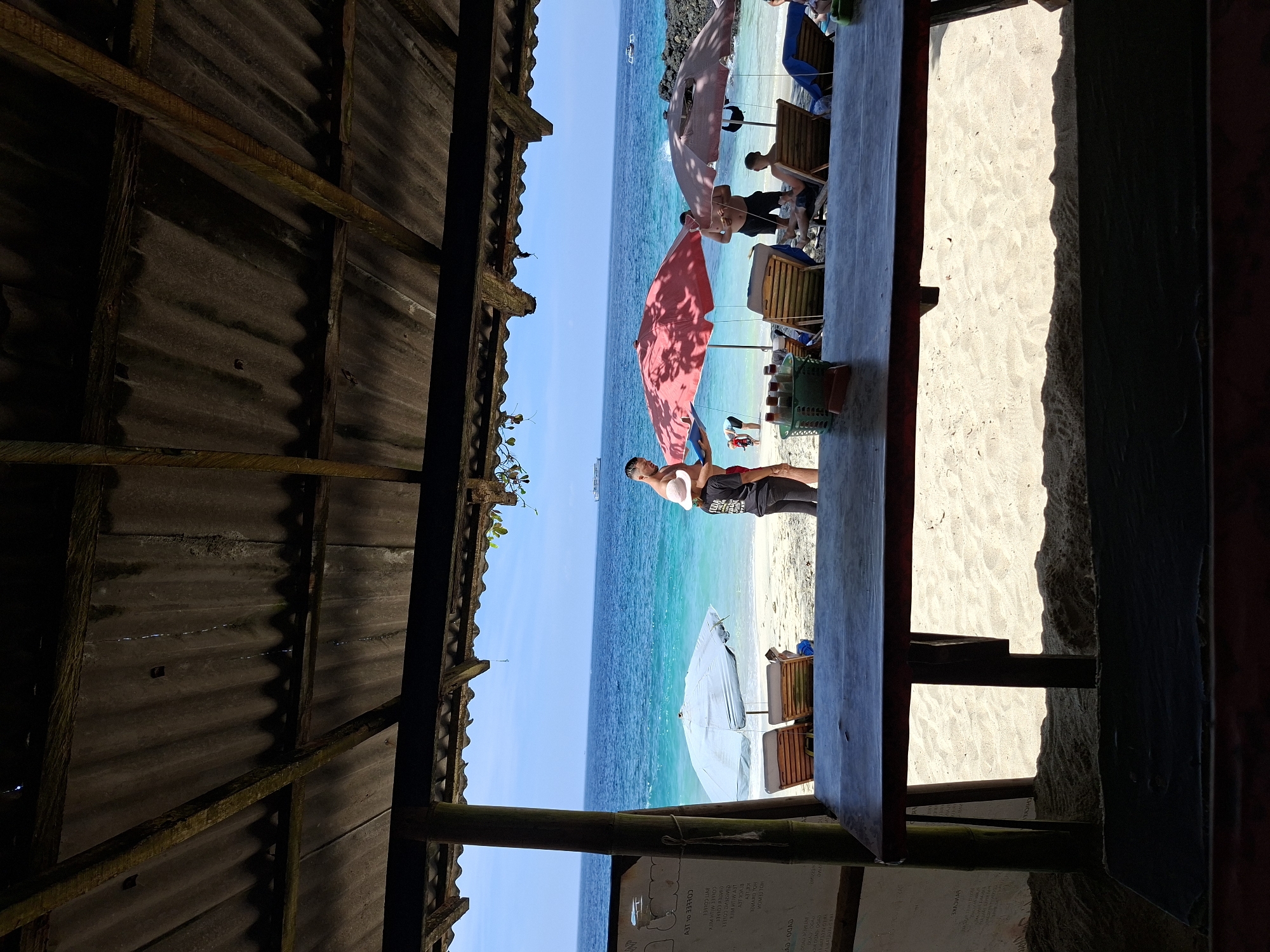 Beachside meal documented at rustic cafe in Manggis, Indonesia