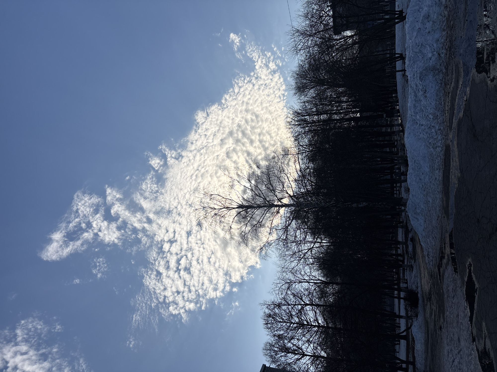 Spring weather scene captured in Ulyanovsk with clouds and snow