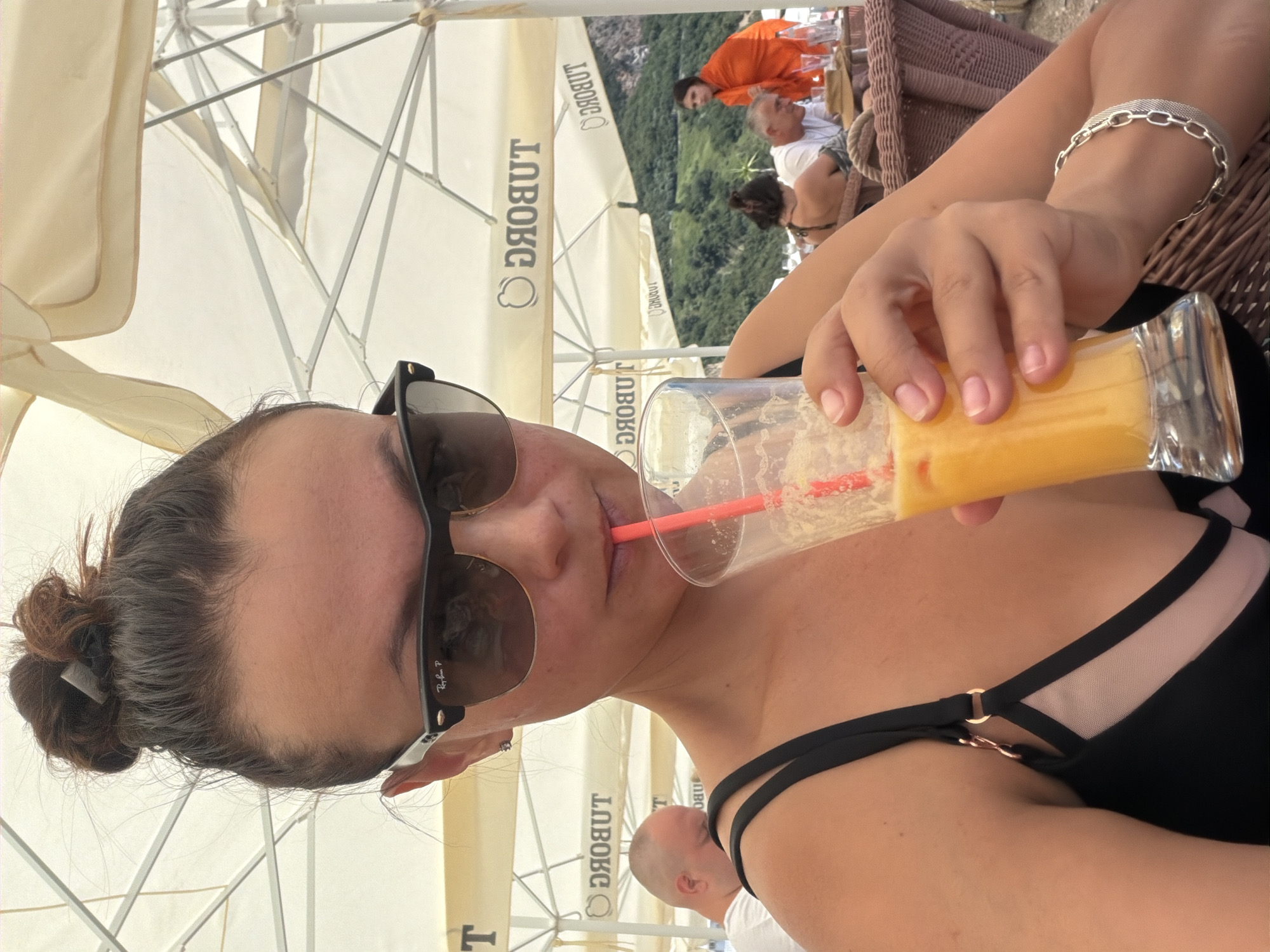 Orange juice and chill time at a Montenegrin beach cafe