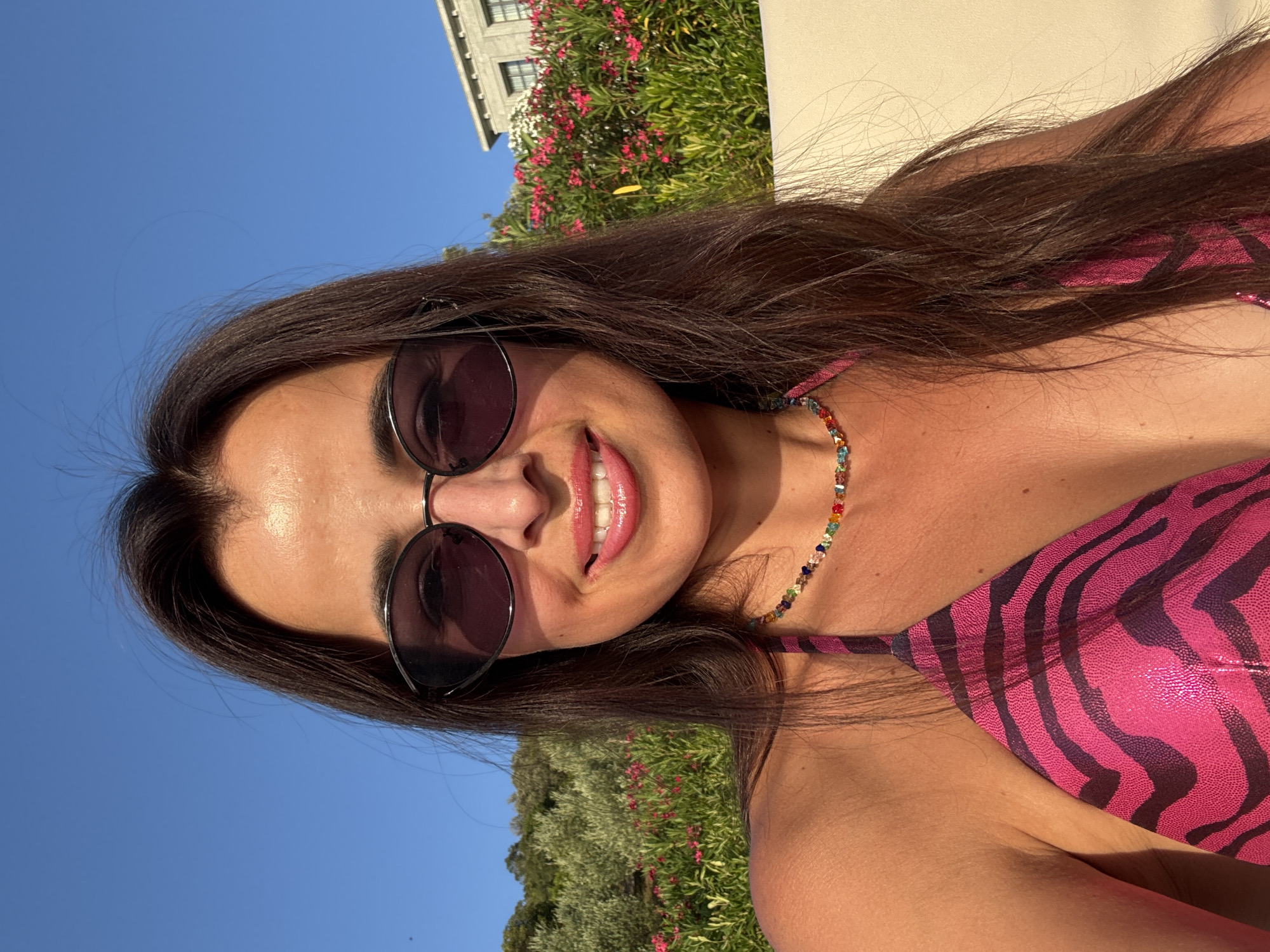 Sunny beach day selfies among bougainvillea and palm trees