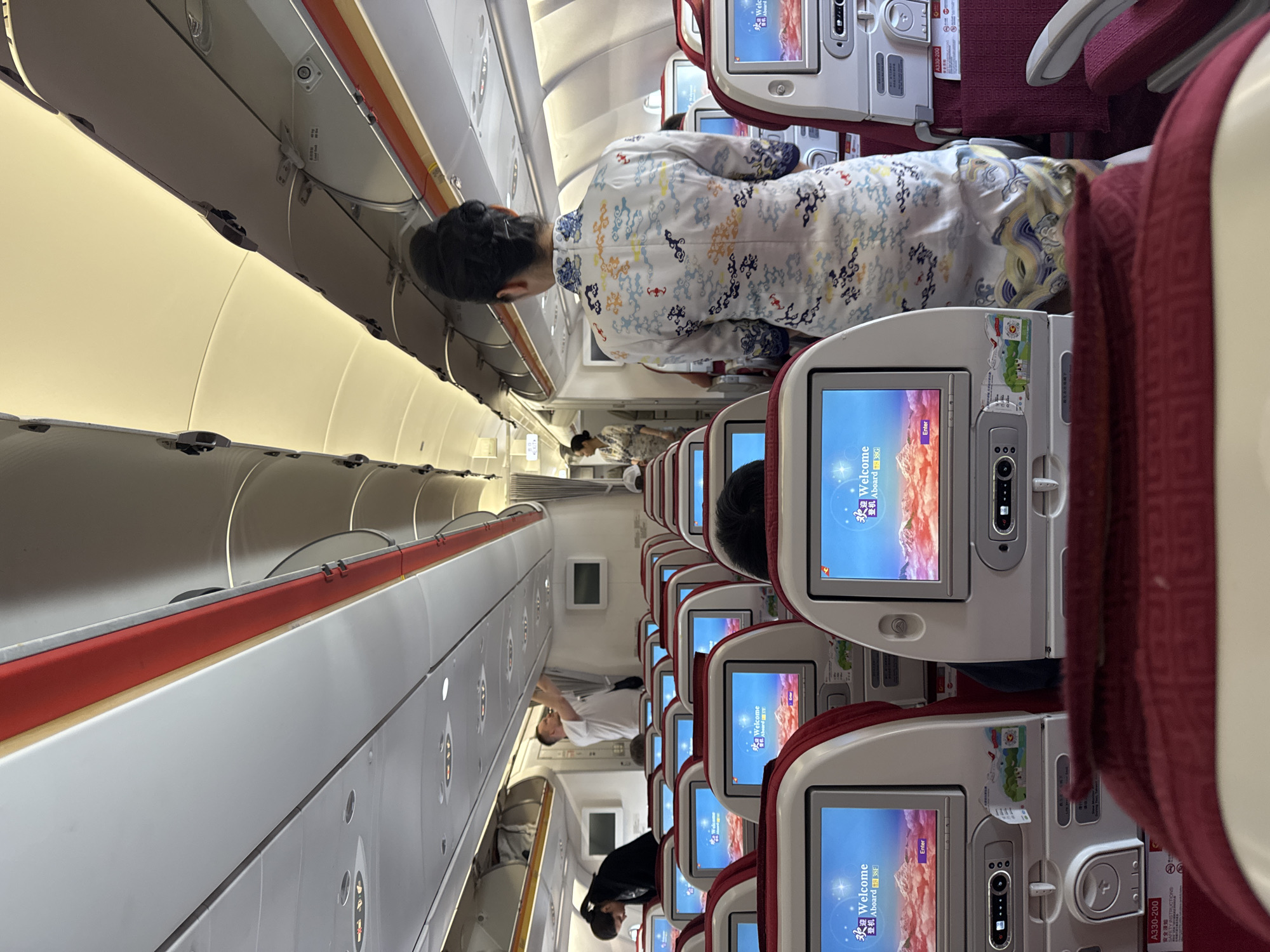 Passenger captures airplane cabin interior during boarding process