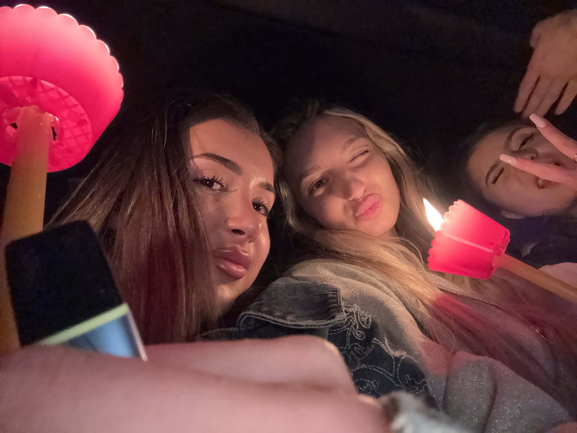 Three women photographed during evening social gathering in Plovdiv