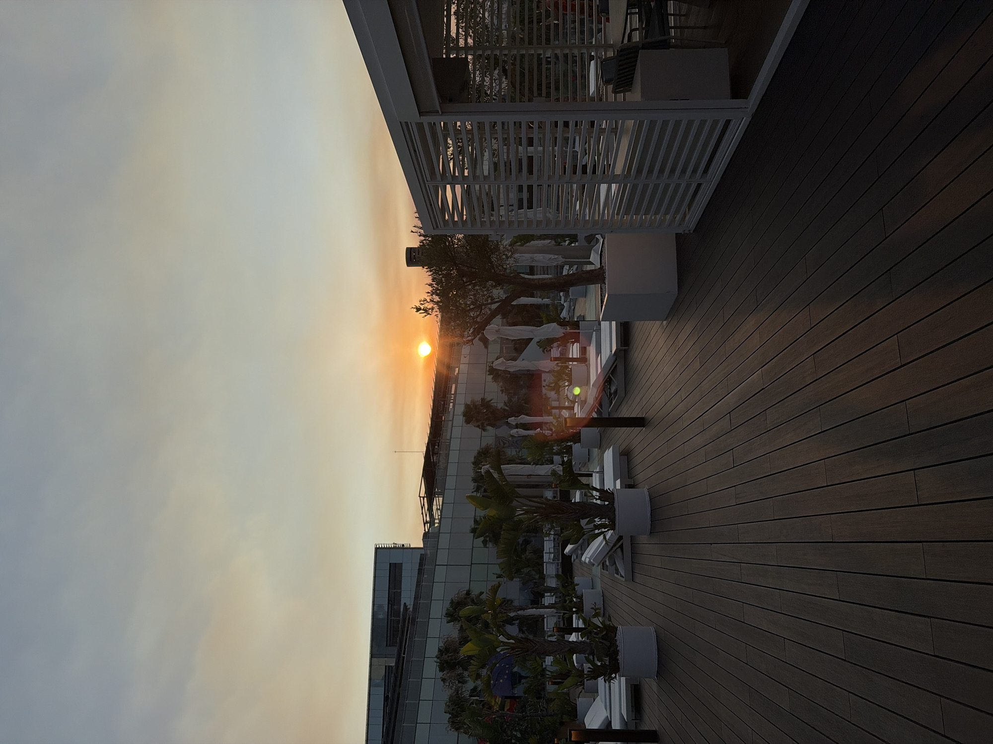 Sunset drinks at a Barcelona beach club rooftop