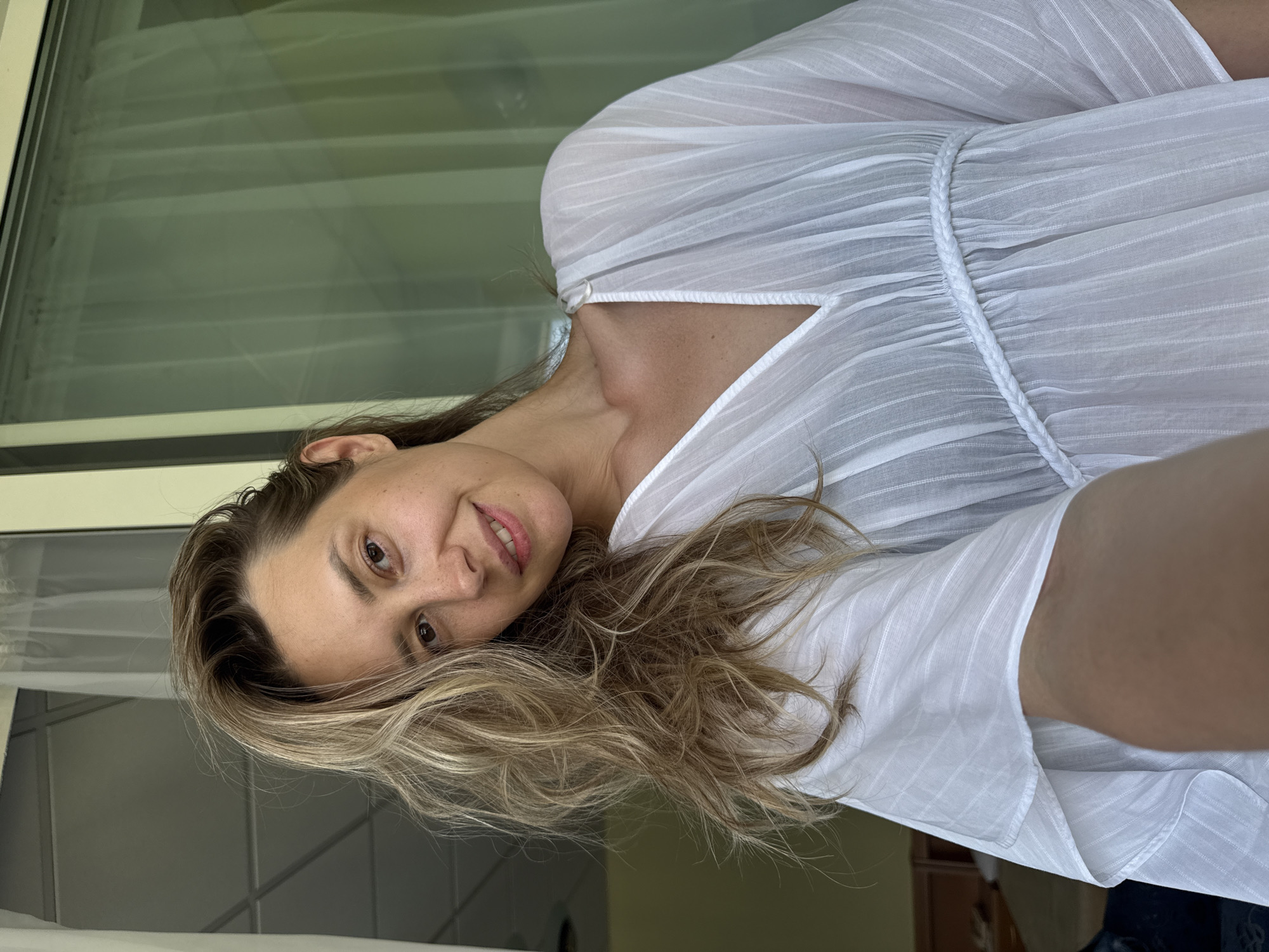 Woman documents summer morning with selfies in Nebug, Russia