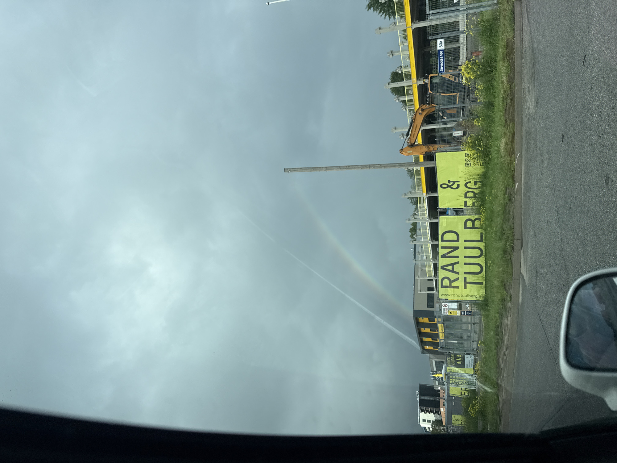 Rainbow over Tallinn captured from multiple city locations