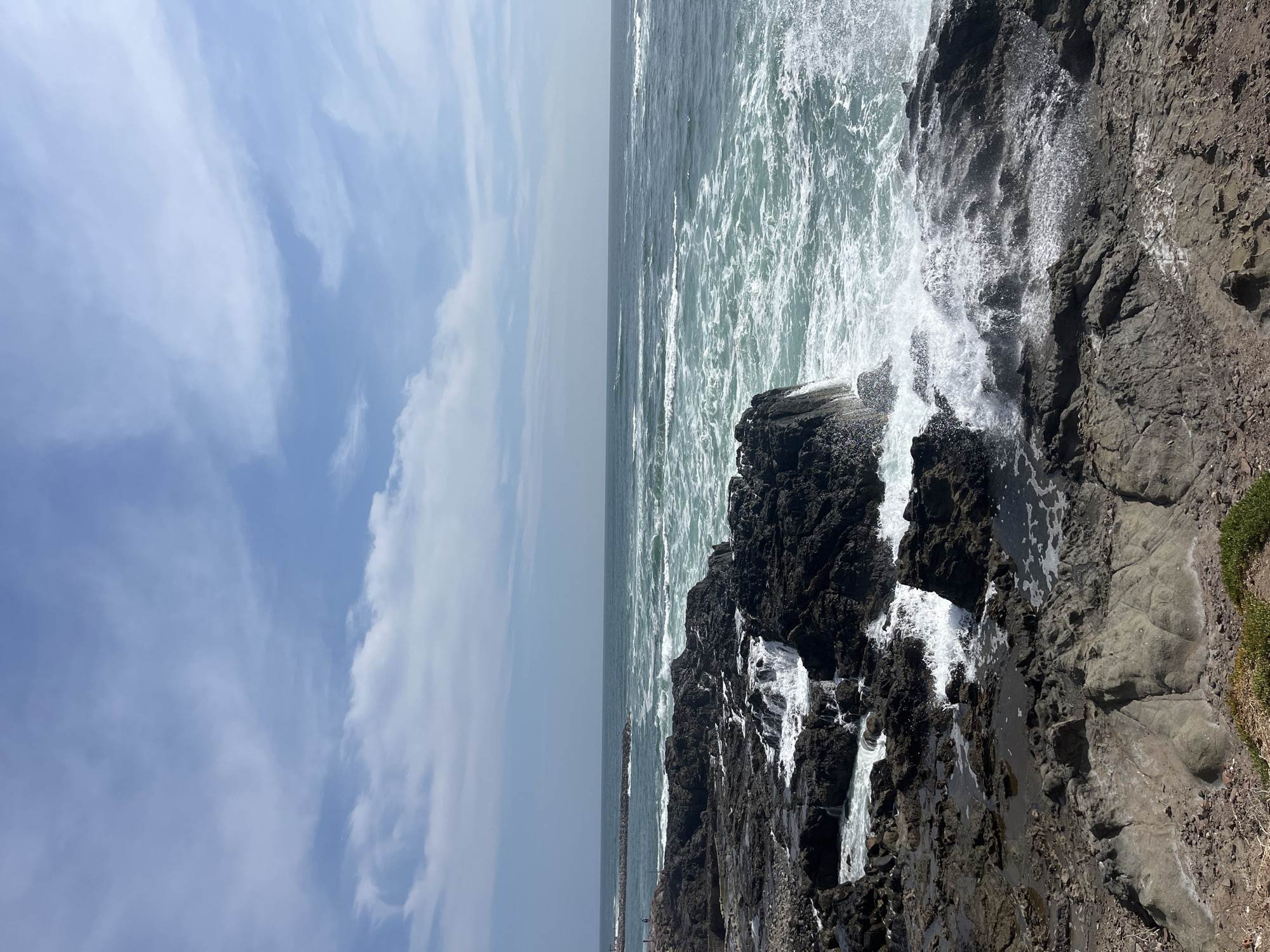 Pacific waves crash against rocky Arica coastline
