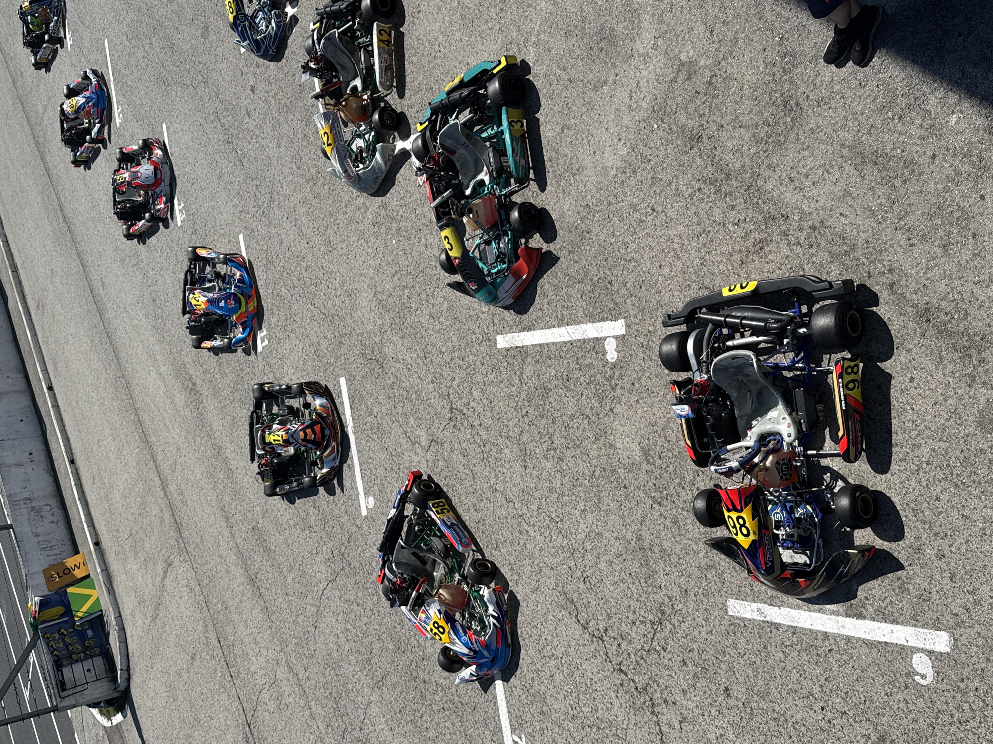 Go-kart lineup and drivers ready at a Ryazan track
