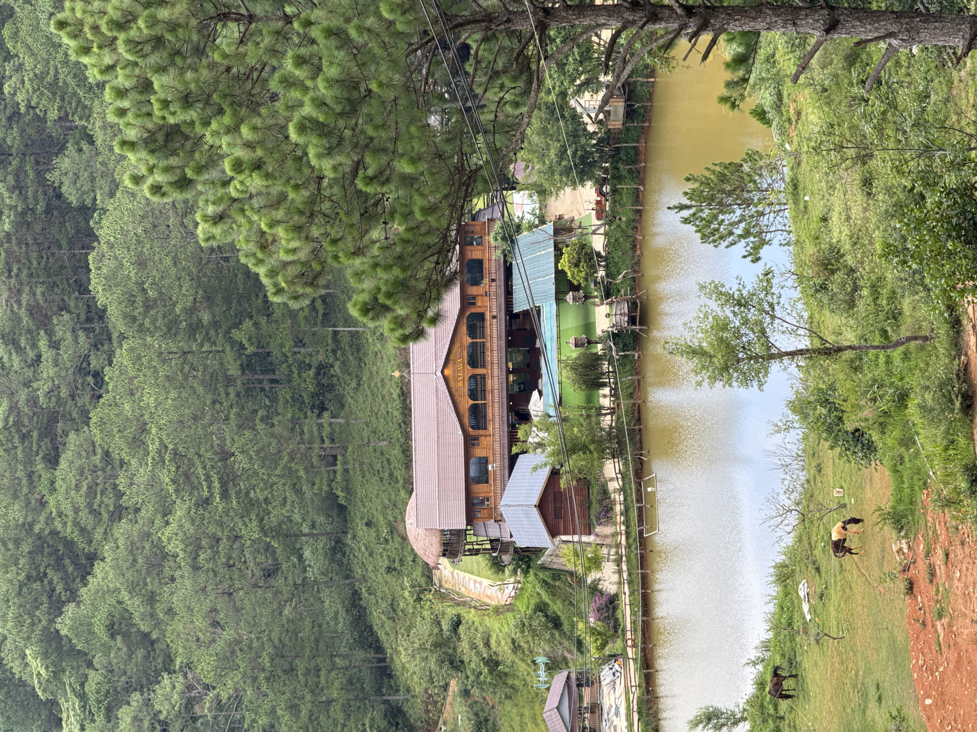 Lakeside building documented in Vietnam's forested highlands