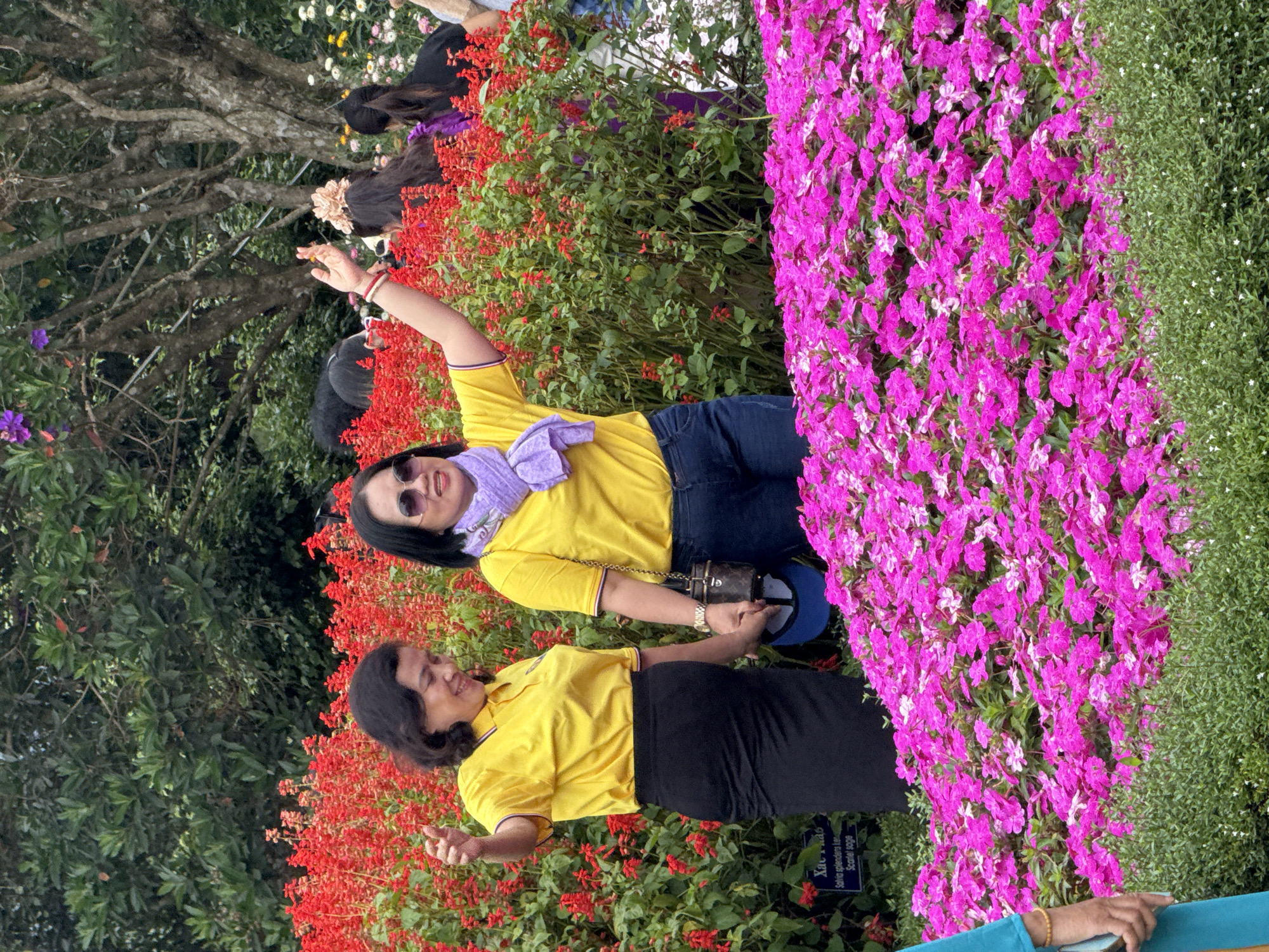 Visitors stroll a flower-lined garden in Da Lat, Vietnam