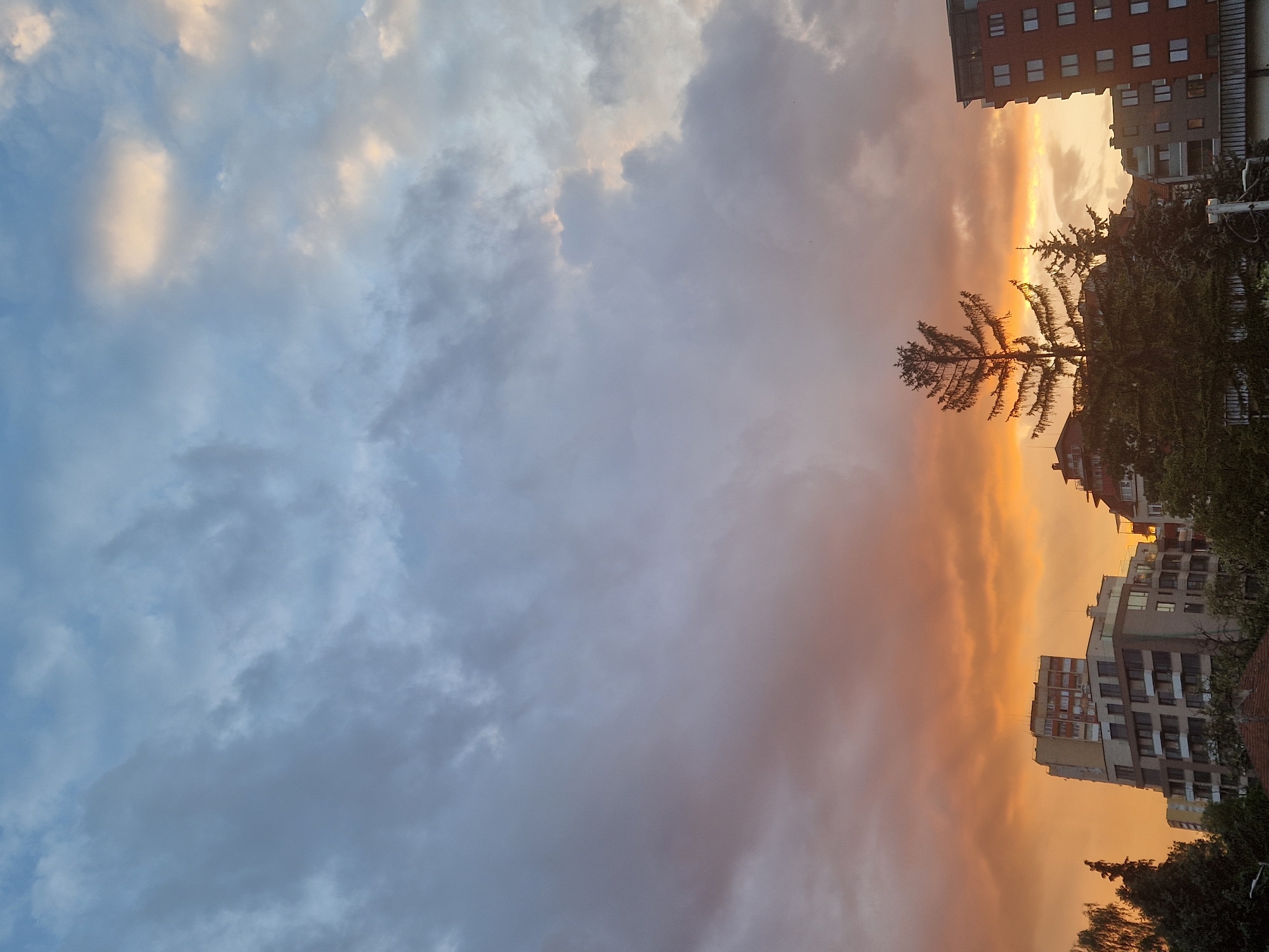 Dramatic divided sunset captured over urban construction zone