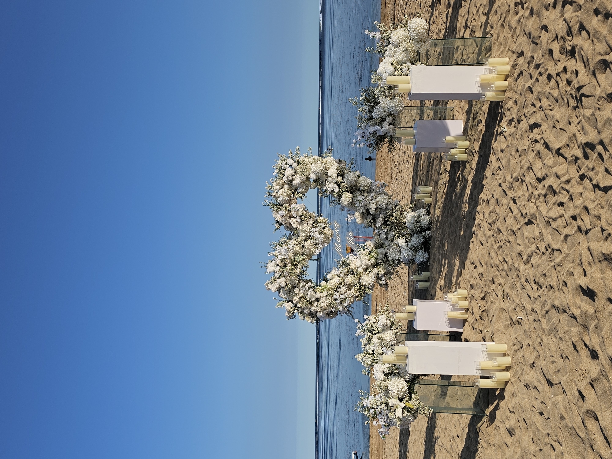 Beach wedding preparations and leisure activities documented in Denpasar