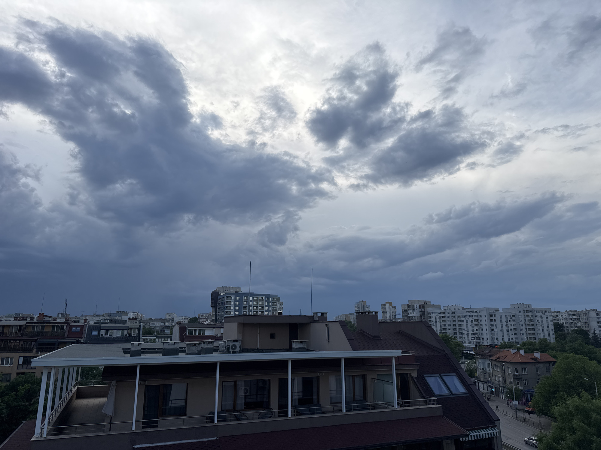 Dark storm clouds gather over urban area