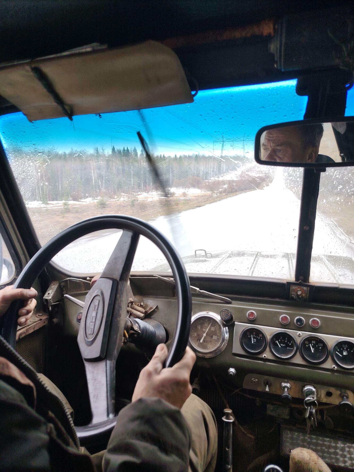 Driver photographed in vintage off-road vehicle in Chaikovsky, Russia