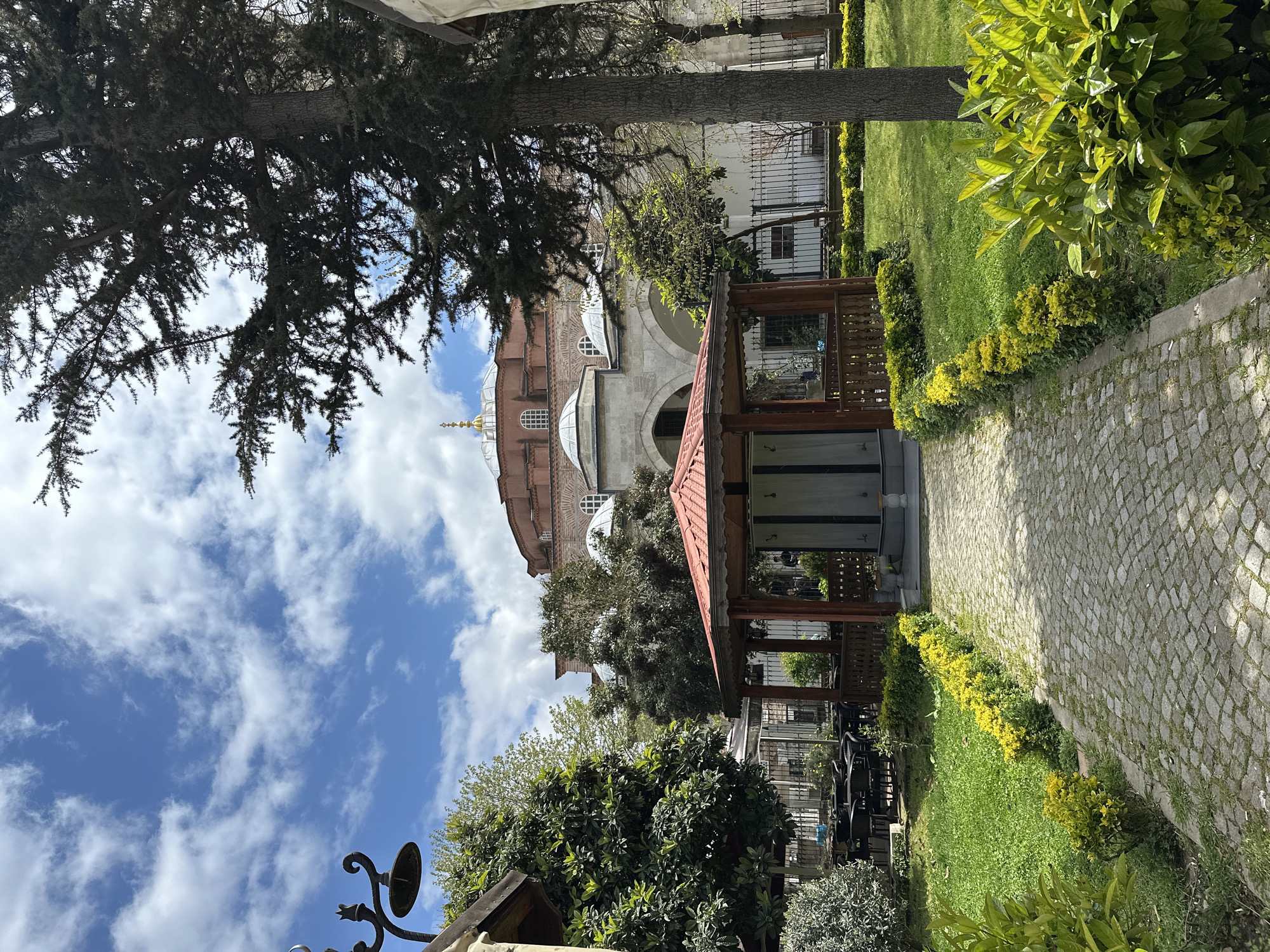 Historic Istanbul site visited during sunny morning with helicopter overhead