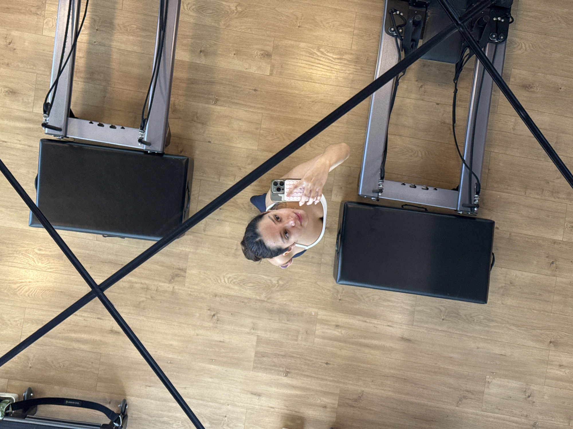 Inside a Puebla Pilates studio, reformers and mirrors.