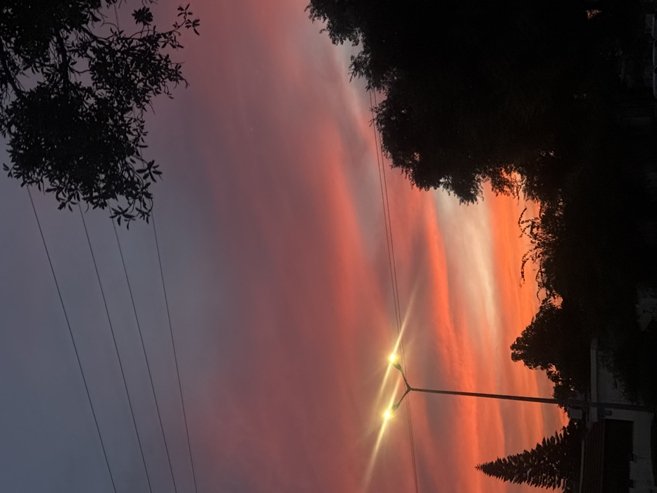Dusk sky photographed over Tel-Aviv street scene